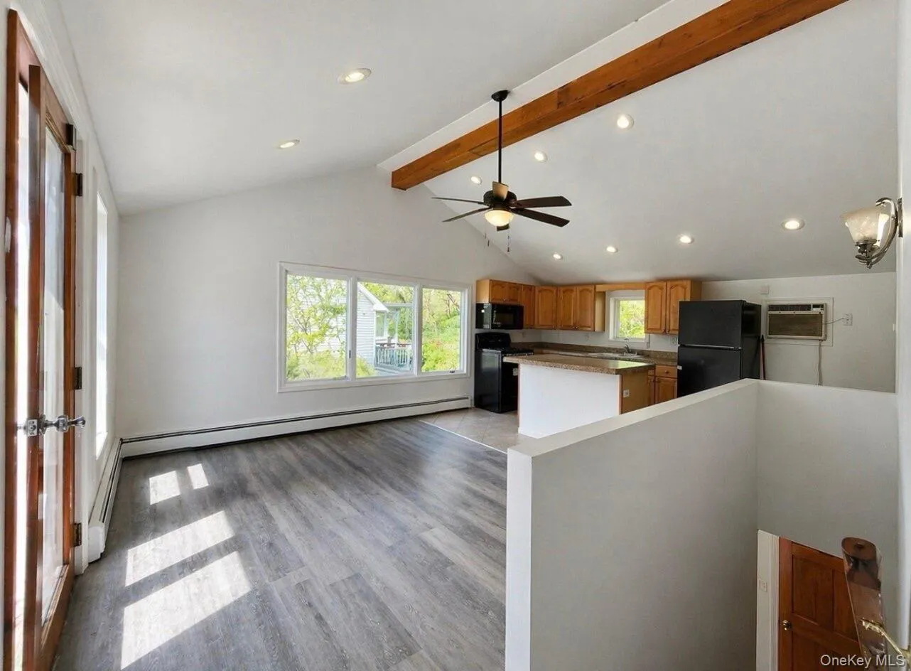 Living room into kitchen. Living room into kitchen.
