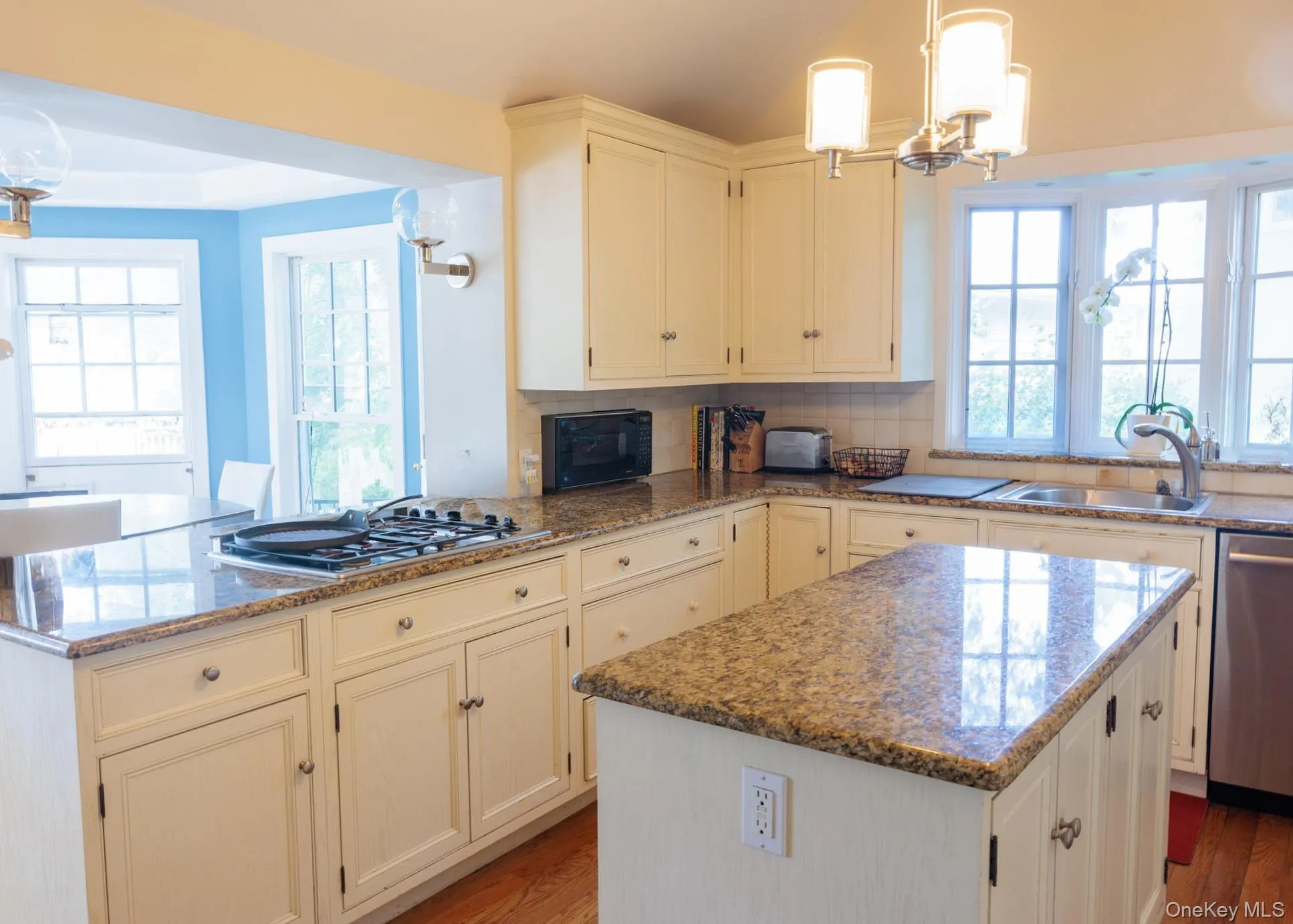 Beautiful chef's kitchen with center island and ample cabinet space. Beautiful chef's kitchen with center island and ample cabinet space.