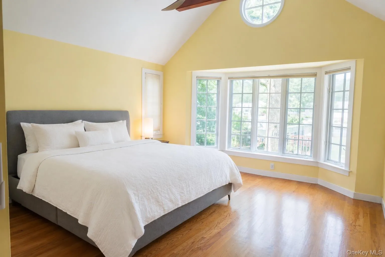 Standout primary bedroom with vaulted cathedral ceilings and large windows. Standout primary bedroom with vaulted cathedral ceilings and large windows.