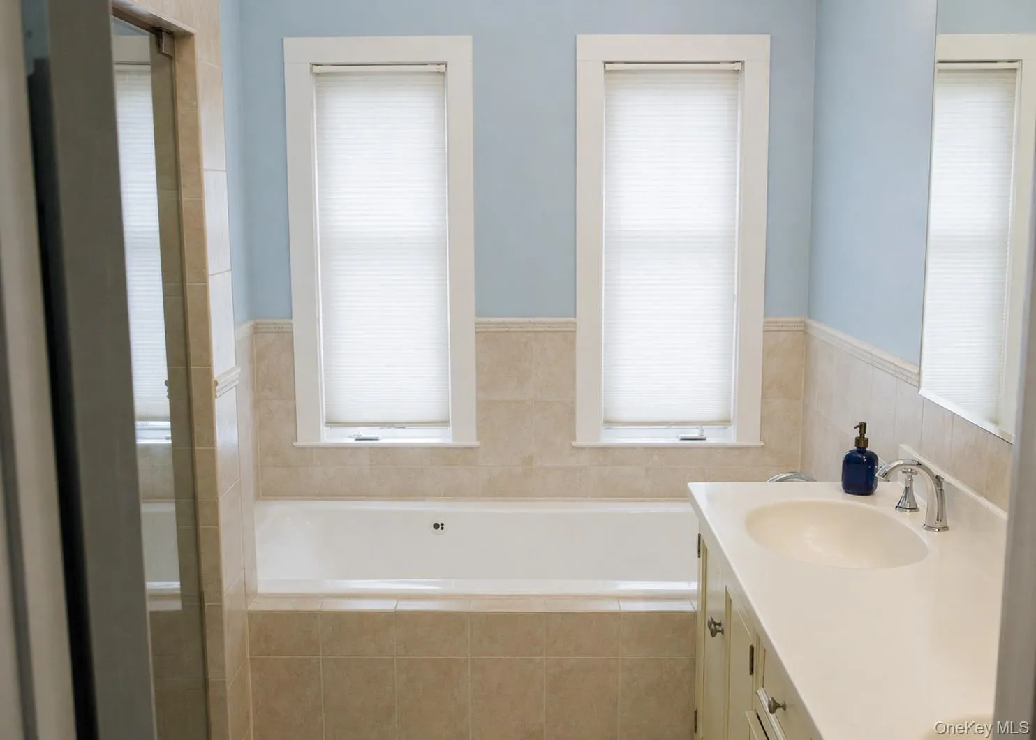 Primary bath with dual vanities. Primary bath with dual vanities.
