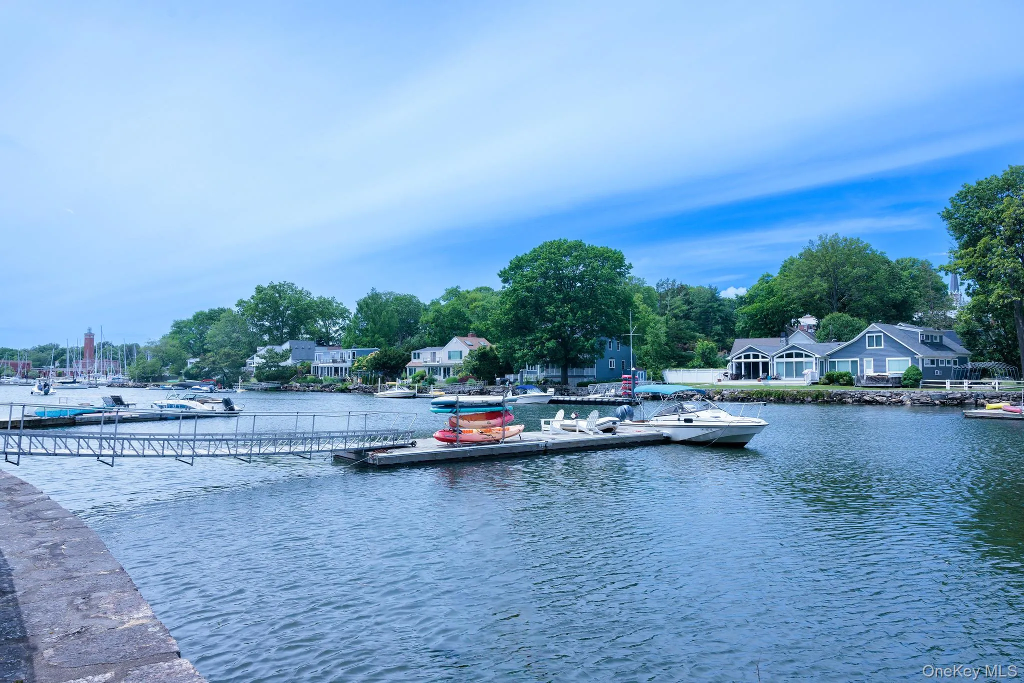 Waterfront property featuring a private dock system and direct water access. Waterfront property featuring a private dock system and direct water access.
