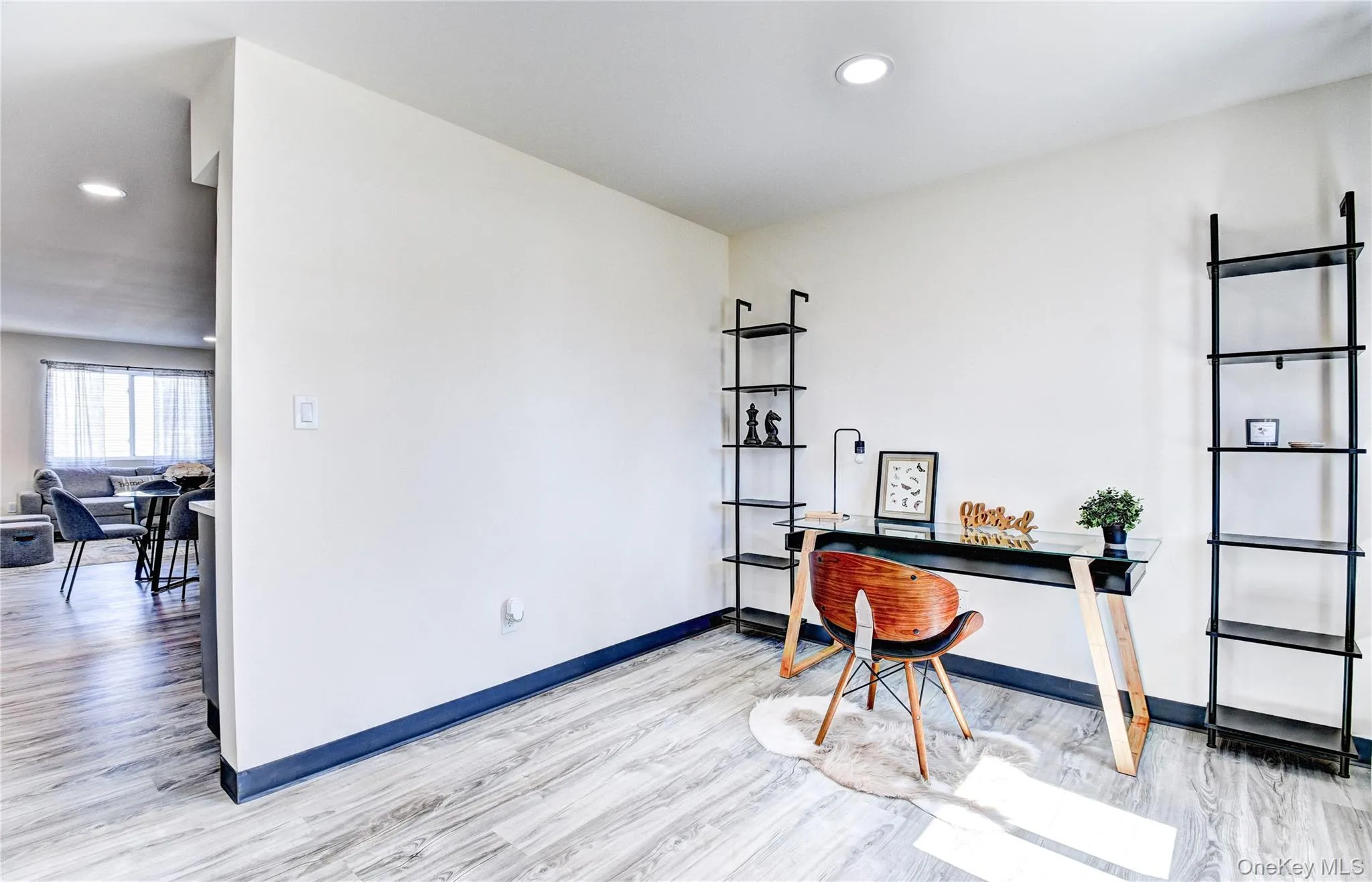 Home office featuring light hardwood / wood-style flooring Home office featuring light hardwood / wood-style flooring