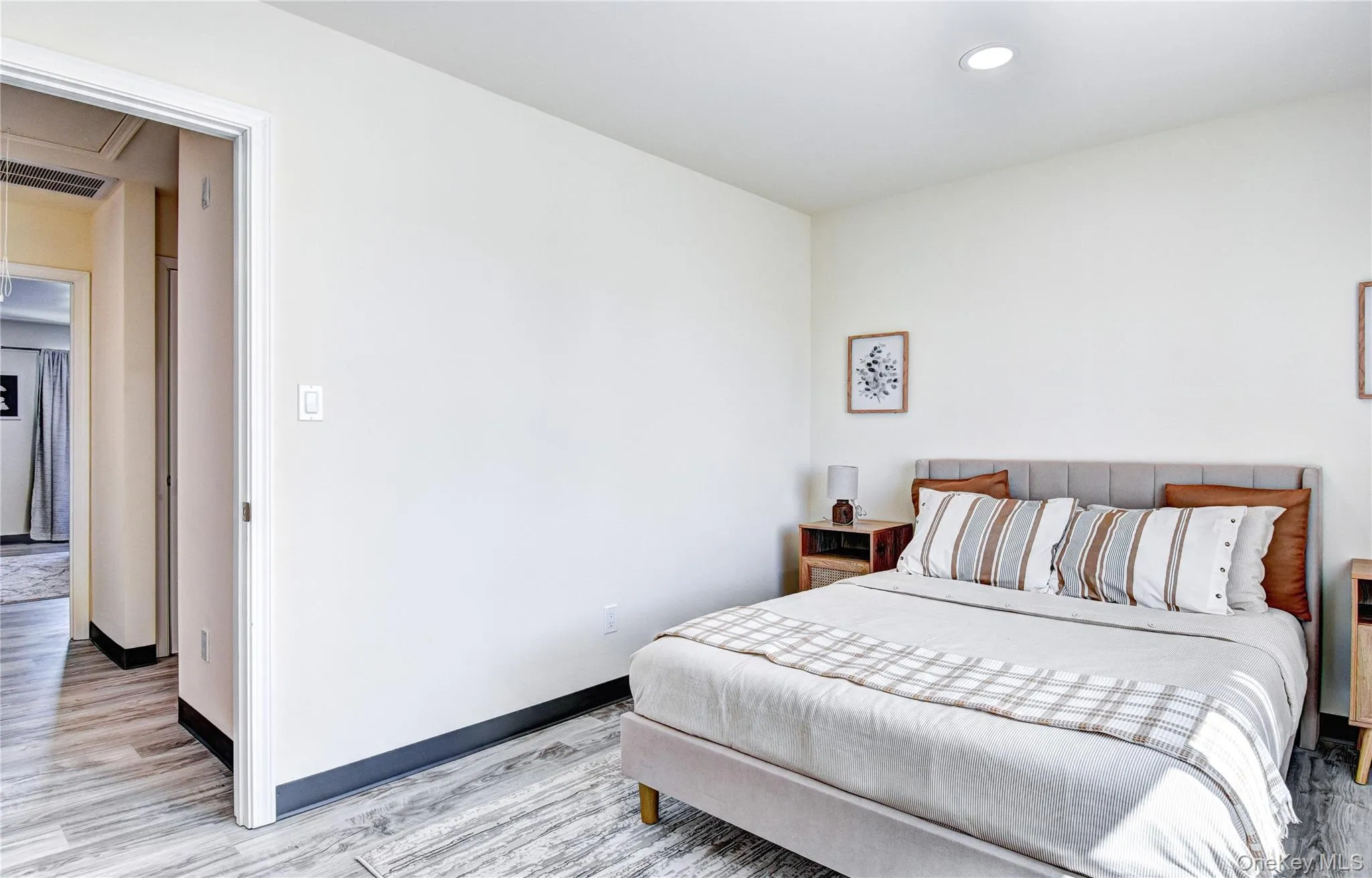Bedroom featuring light hardwood / wood-style floors Bedroom featuring light hardwood / wood-style floors