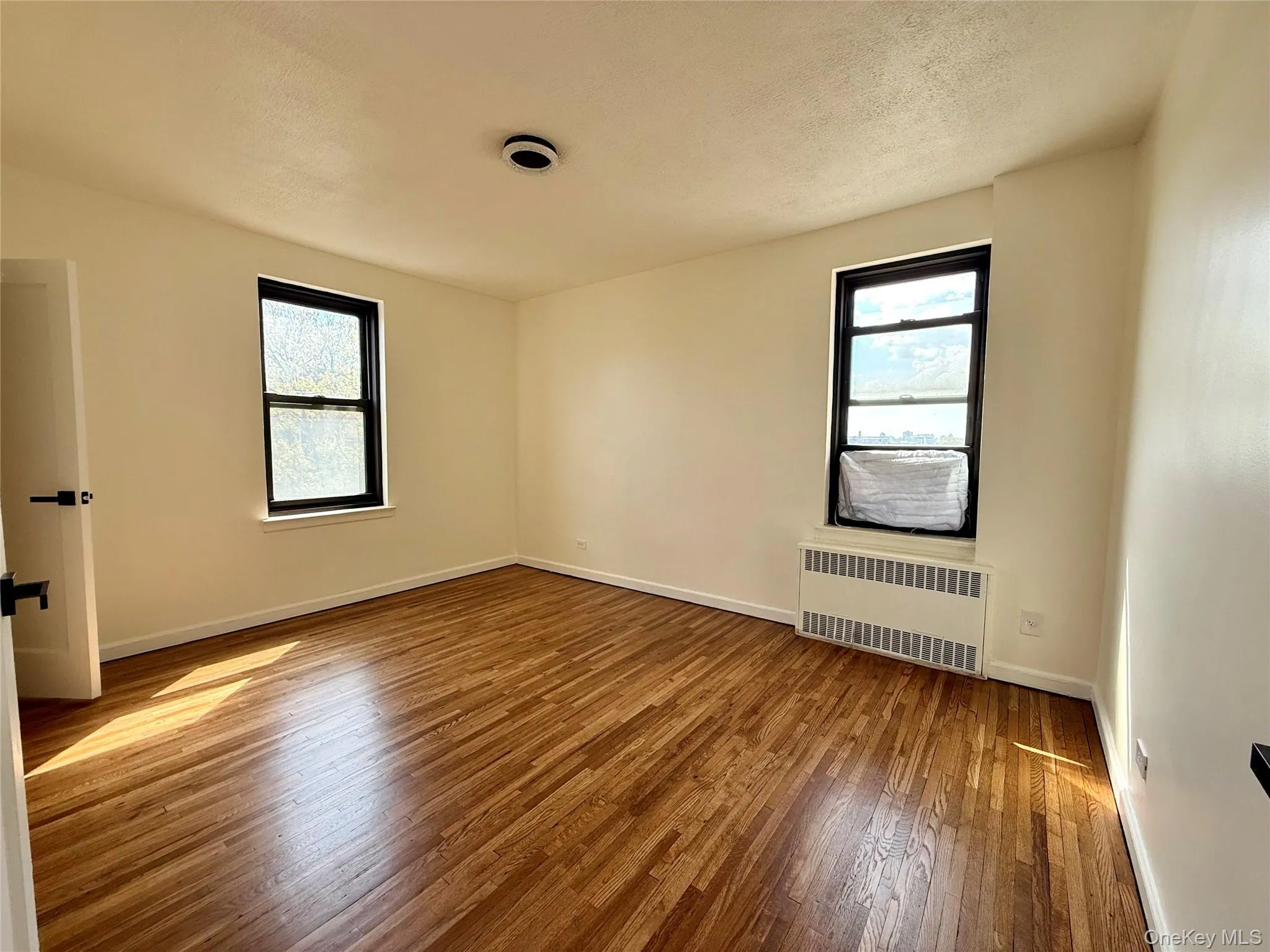 Corner bedroom with 2 opposite side windows, 2 closets. Ceiling light, hardwood floors. Great view of Cityfield Corner bedroom with 2 opposite side windows, 2 closets. Ceiling light, hardwood floors. Great view of Cityfield