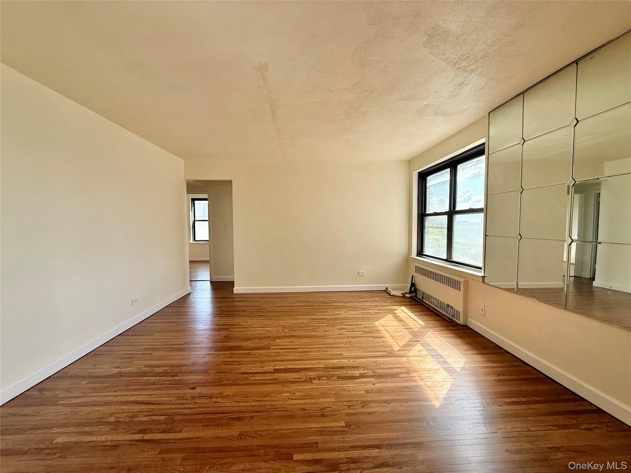 Large living room with double panel window, top floor provides excellent natural light, hardwood floors. Open to the dining area and kitchen. Large living room with double panel window, top floor provides excellent natural light, hardwood floors. Open to the dining area and kitchen.