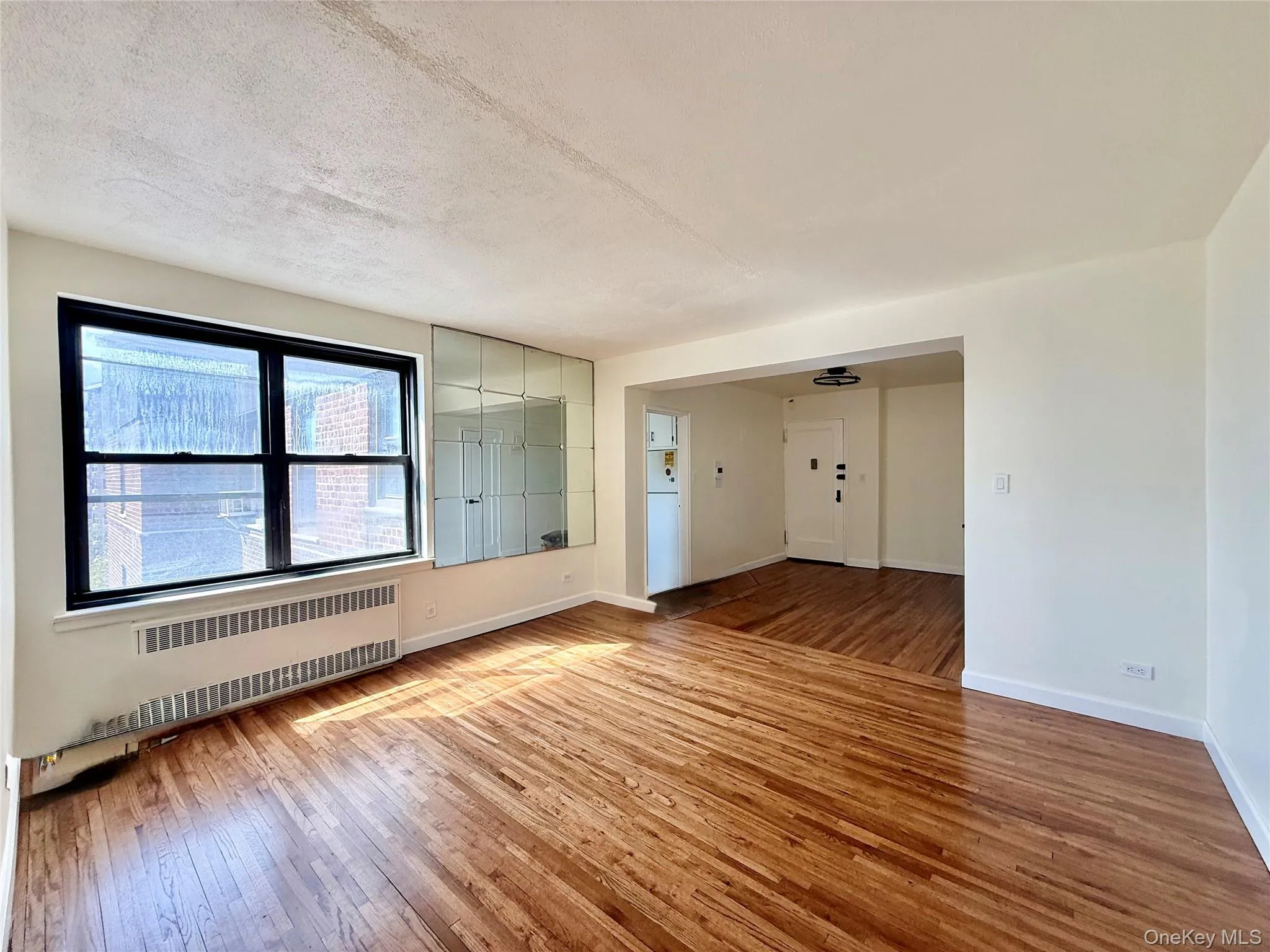 Large living room with double panel window, top floor provides excellent natural light, hardwood floors. Open to the dining area and kitchen. Large living room with double panel window, top floor provides excellent natural light, hardwood floors. Open to the dining area and kitchen.