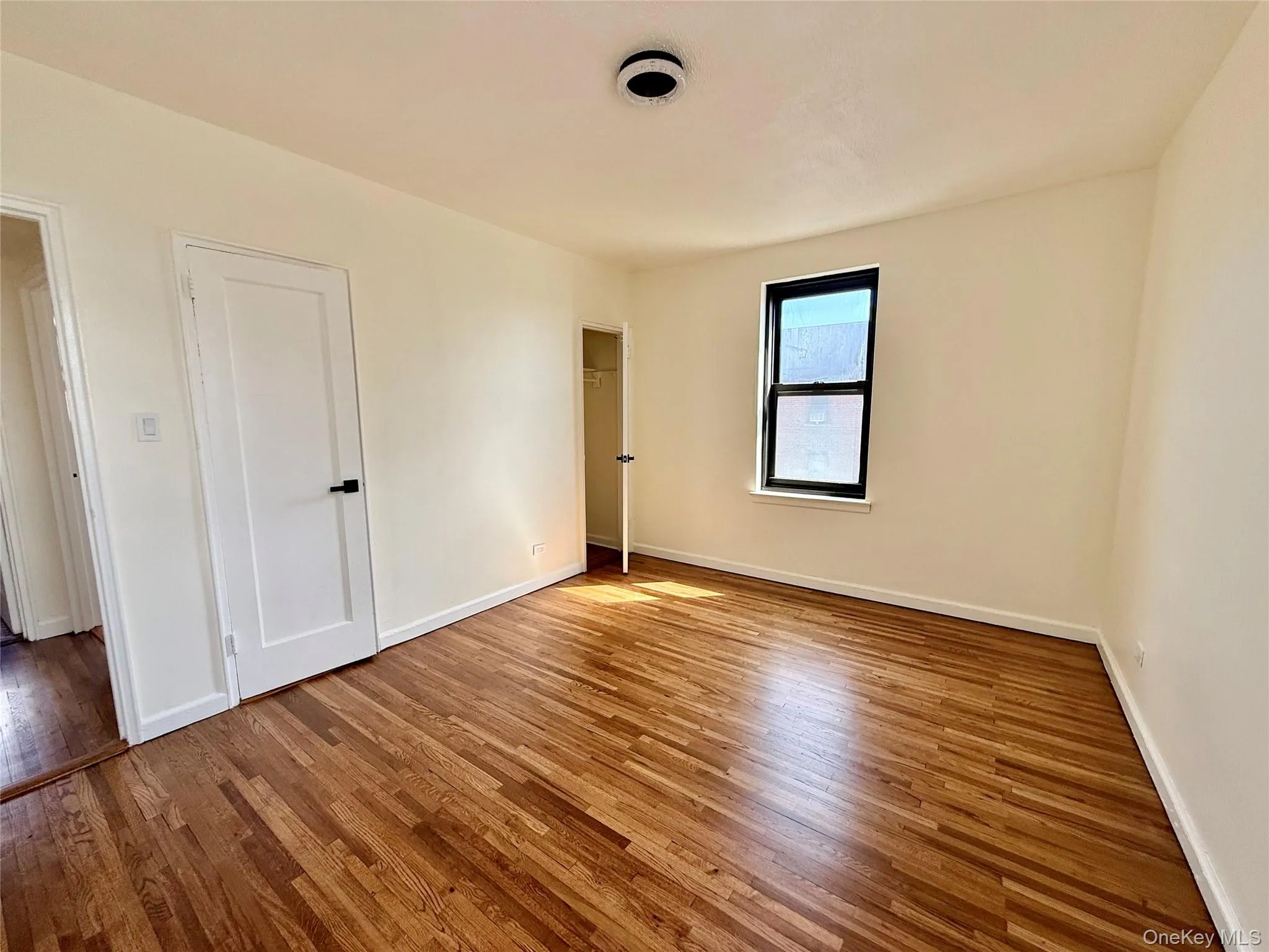 Corner bedroom with 2 opposite side windows, 2 closets. Ceiling light, hardwood floors. Great view of Cityfield Corner bedroom with 2 opposite side windows, 2 closets. Ceiling light, hardwood floors. Great view of Cityfield