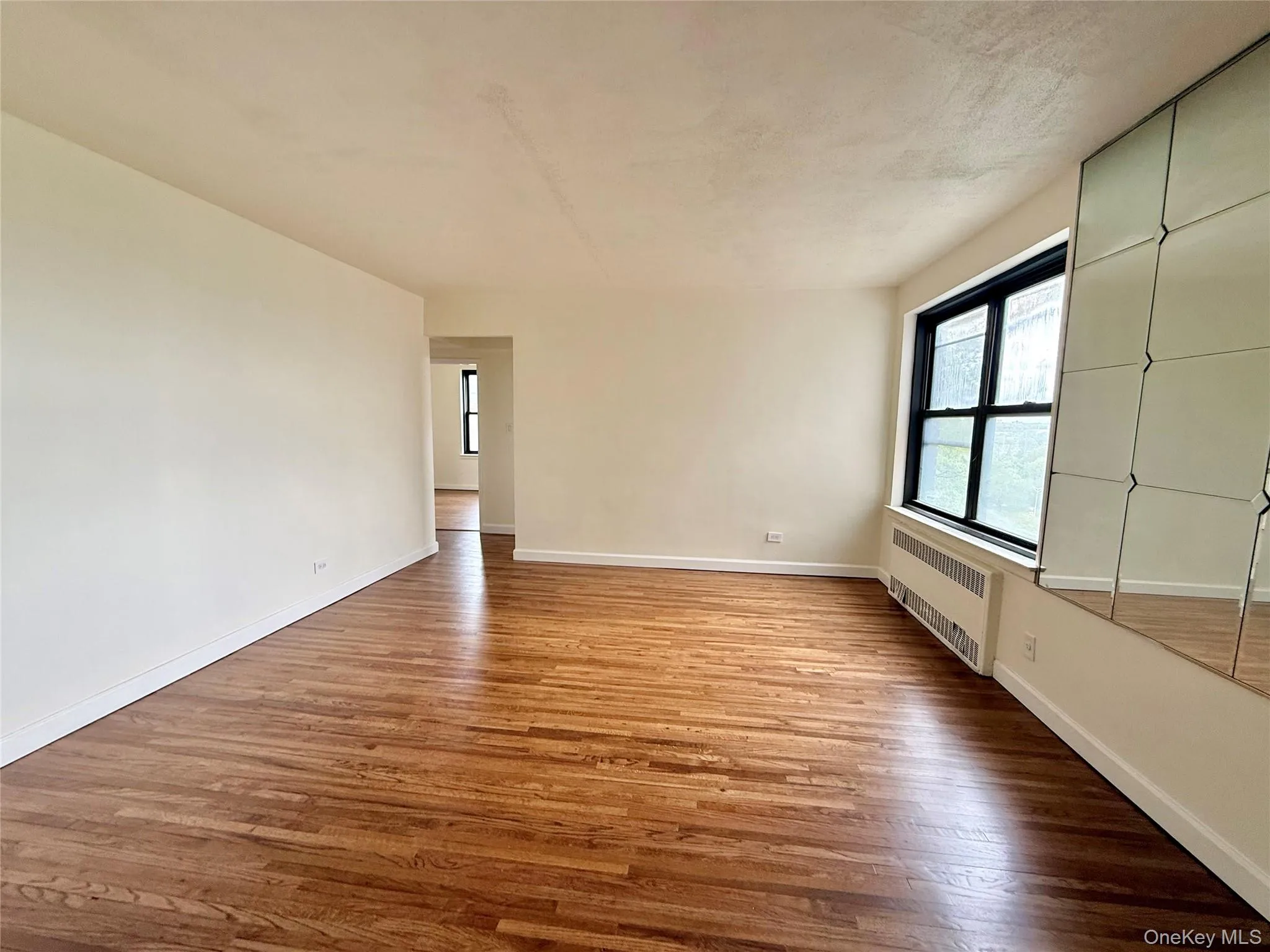 Large living room with double panel window, top floor provides excellent natural light, hardwood floors. Open to the dining area and kitchen. Large living room with double panel window, top floor provides excellent natural light, hardwood floors. Open to the dining area and kitchen.