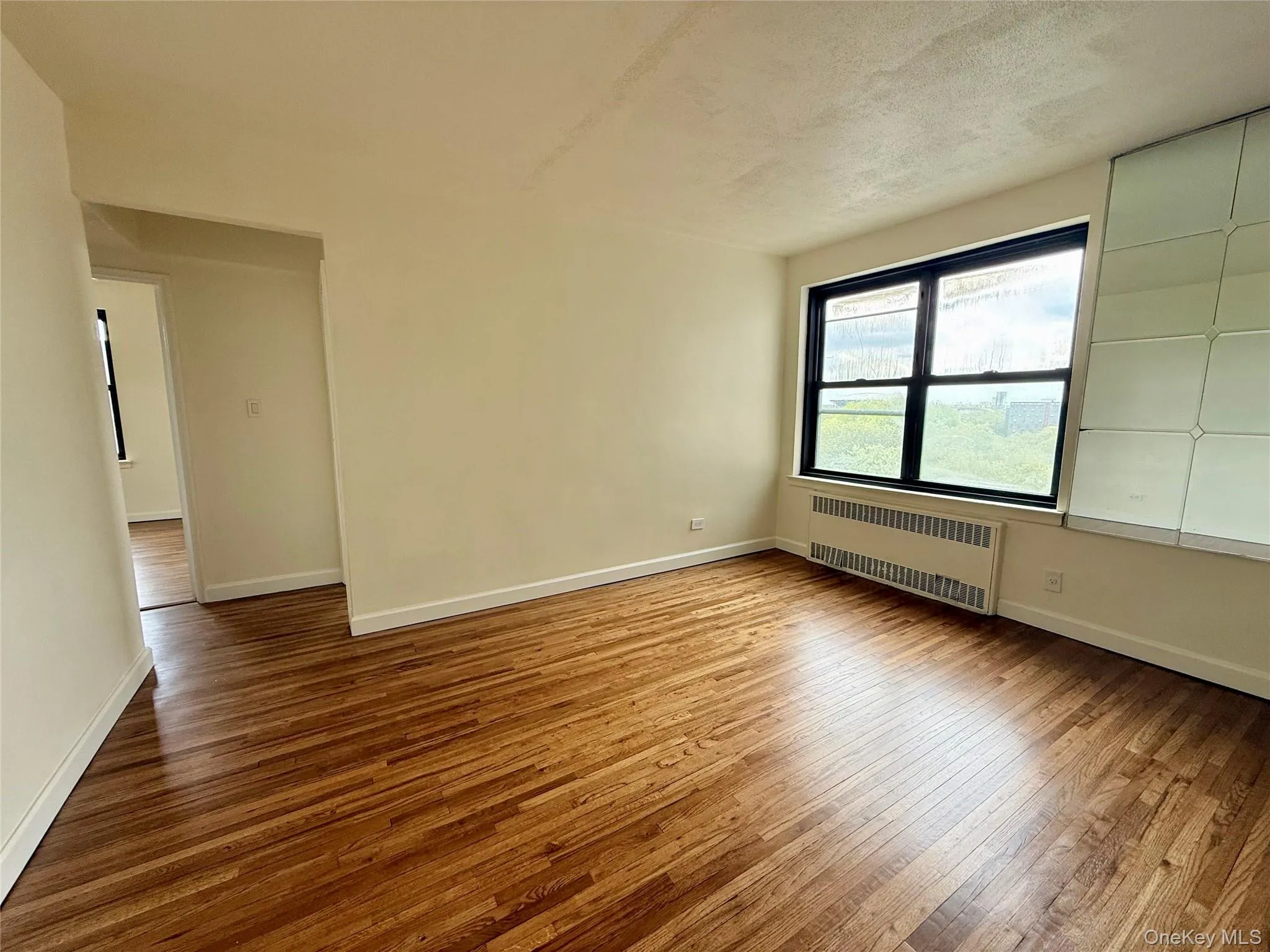 Large living room with double panel window, top floor provides excellent natural light, hardwood floors. Open to the dining area and kitchen. Large living room with double panel window, top floor provides excellent natural light, hardwood floors. Open to the dining area and kitchen.