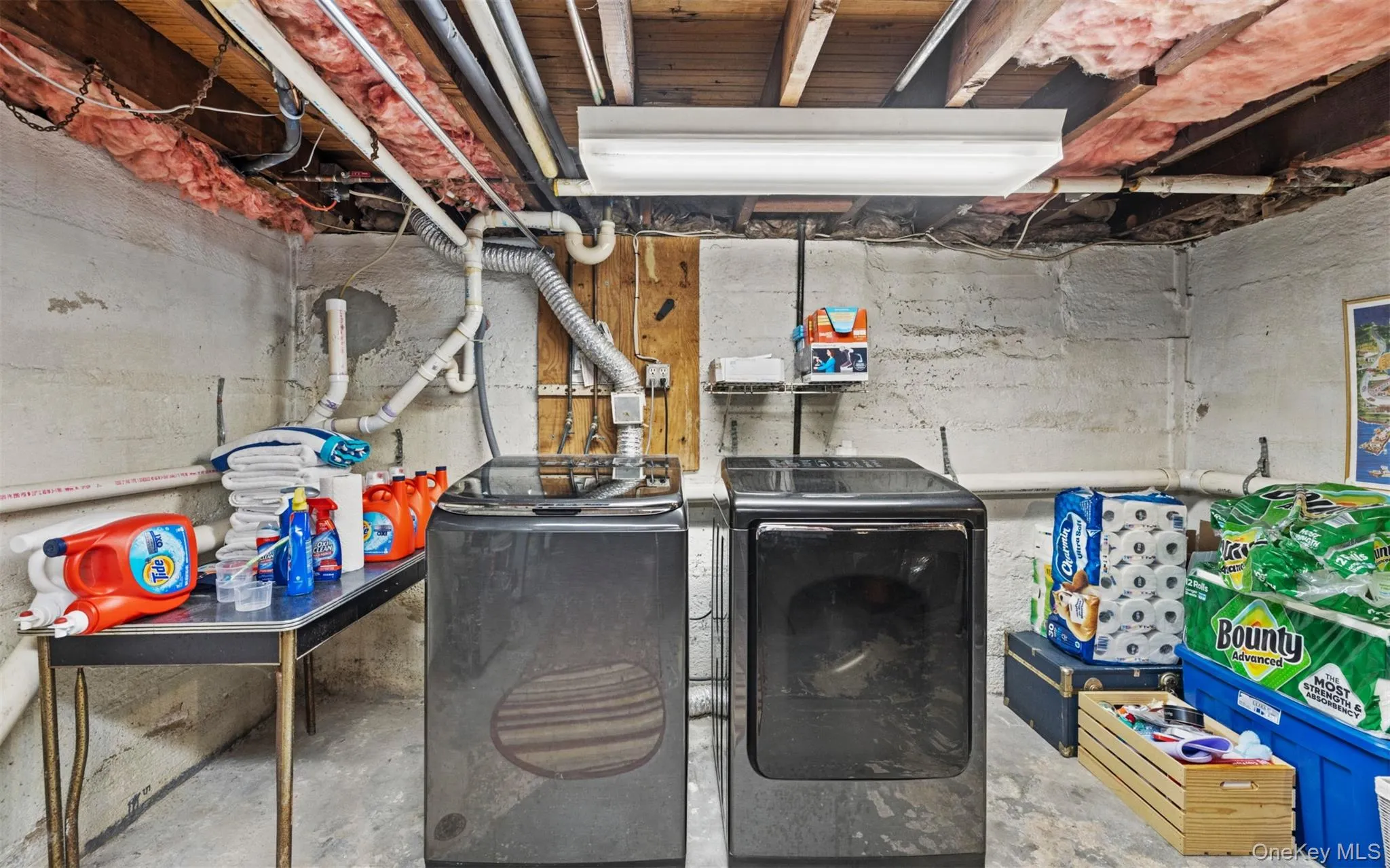 Dedicated utility area featuring a washer and dryer Dedicated utility area featuring a washer and dryer