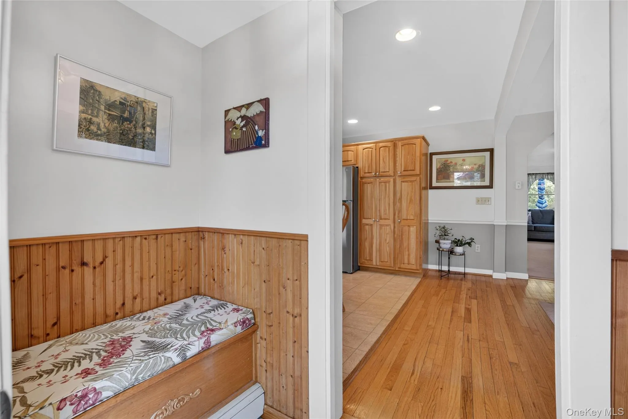 A bonus entryway with a cushioned seat and storage under the seat. A bonus entryway with a cushioned seat and storage under the seat.