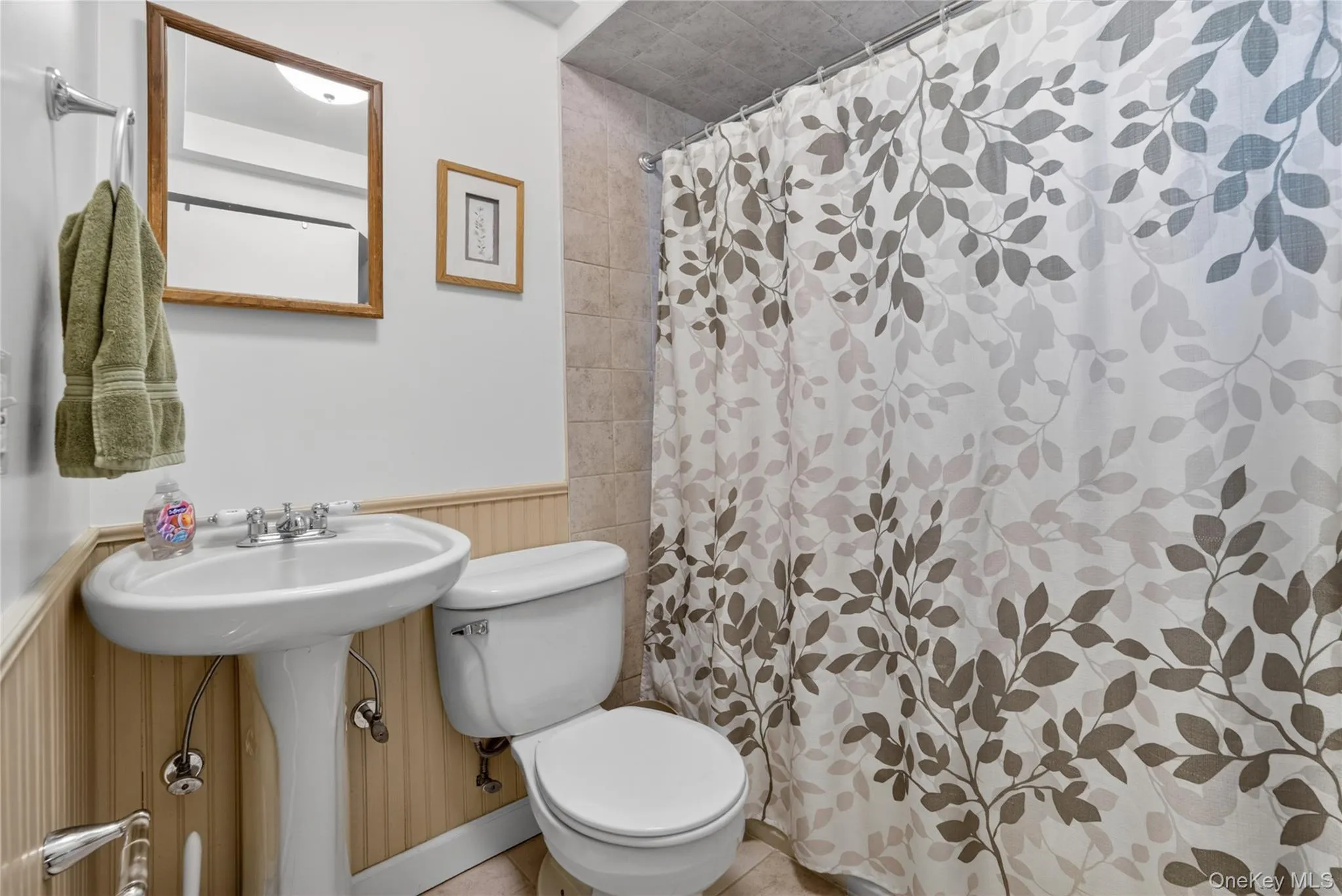 Main bath with white features, wainscoting, neutral and updated. Main bath with white features, wainscoting, neutral and updated.
