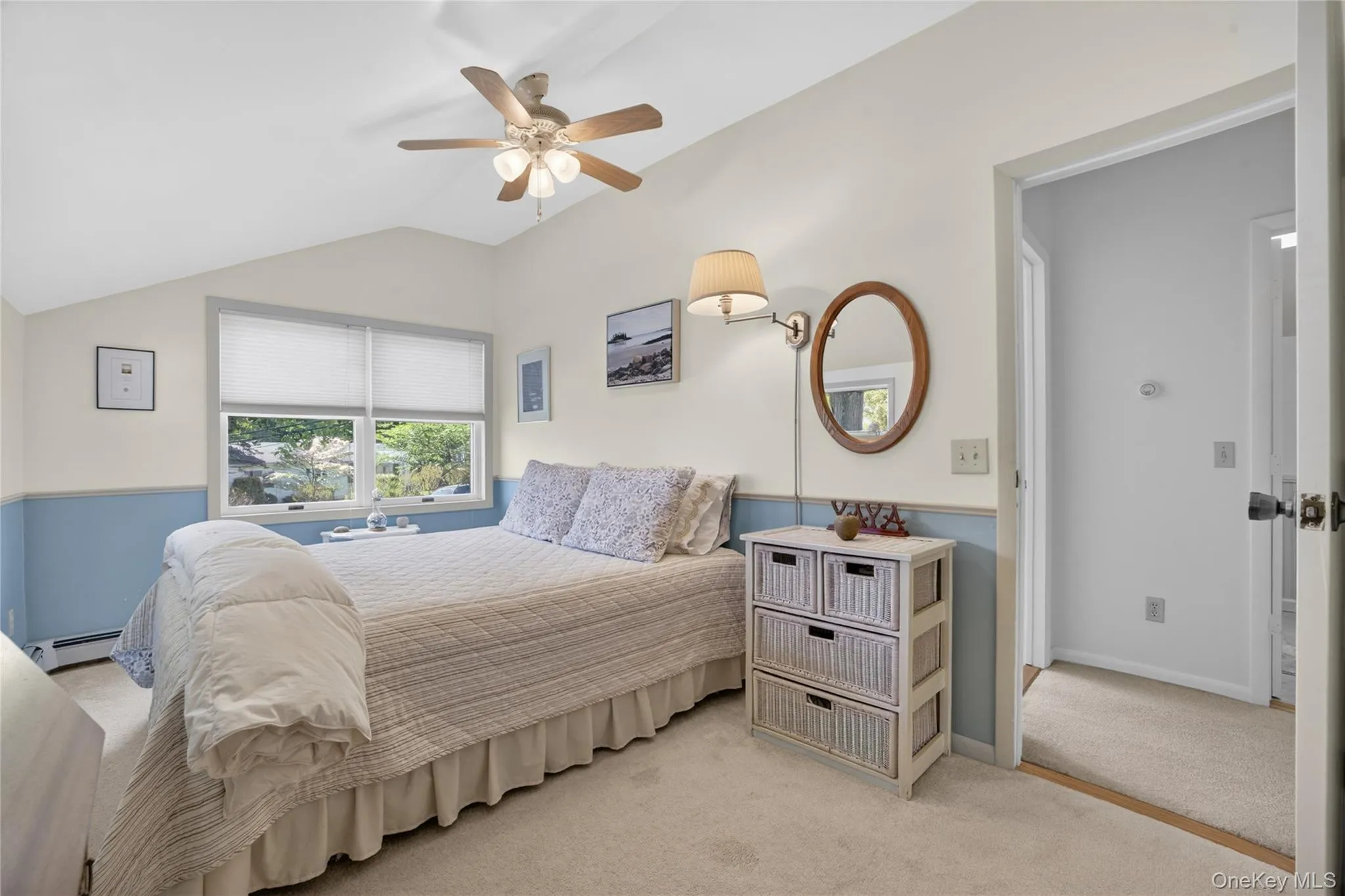 Overhead ceiling fan and lighting with a vaulted type ceiling. Overhead ceiling fan and lighting with a vaulted type ceiling.