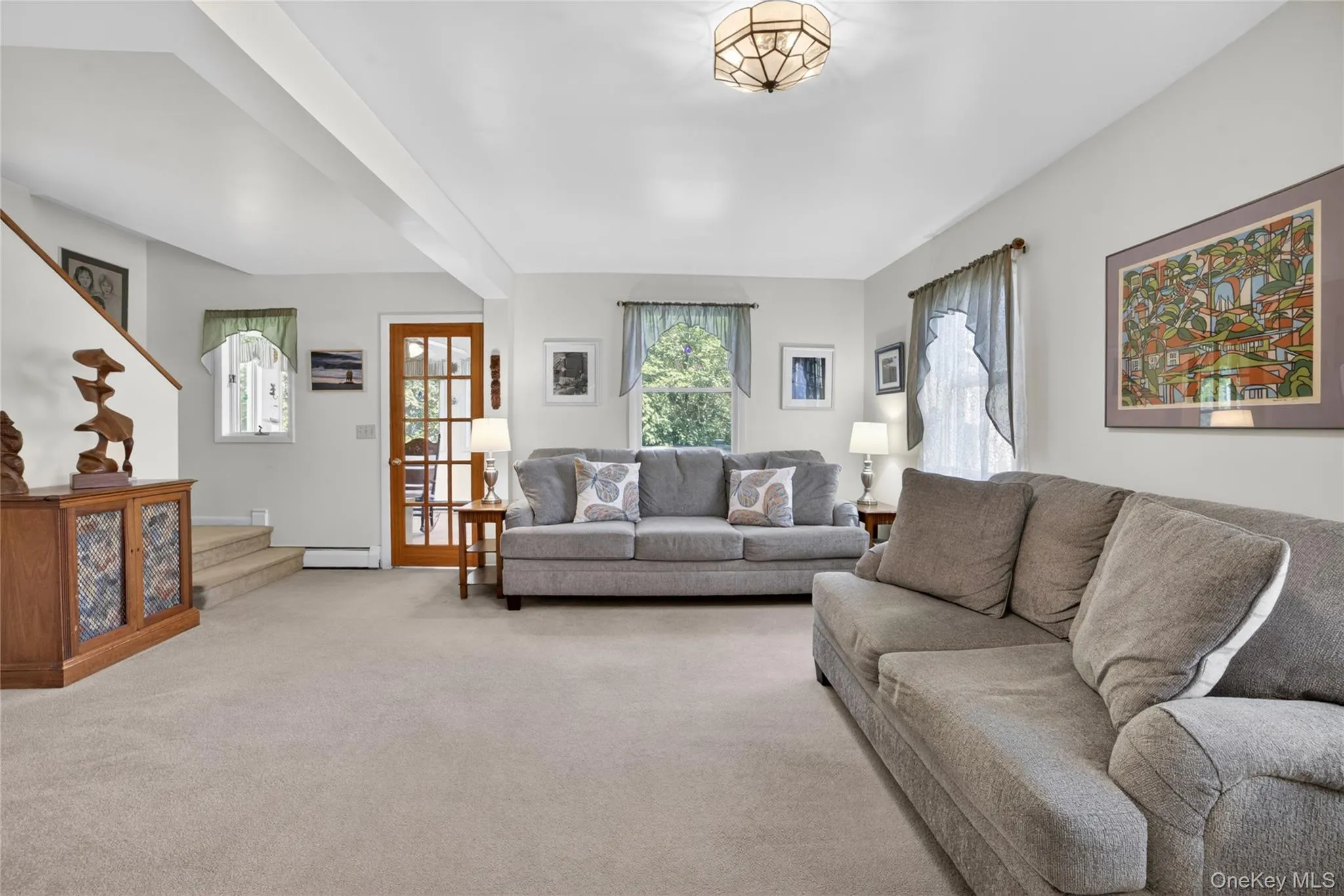Neutral carpeting, overhead lighting, and an abundance of natural light. Neutral carpeting, overhead lighting, and an abundance of natural light.