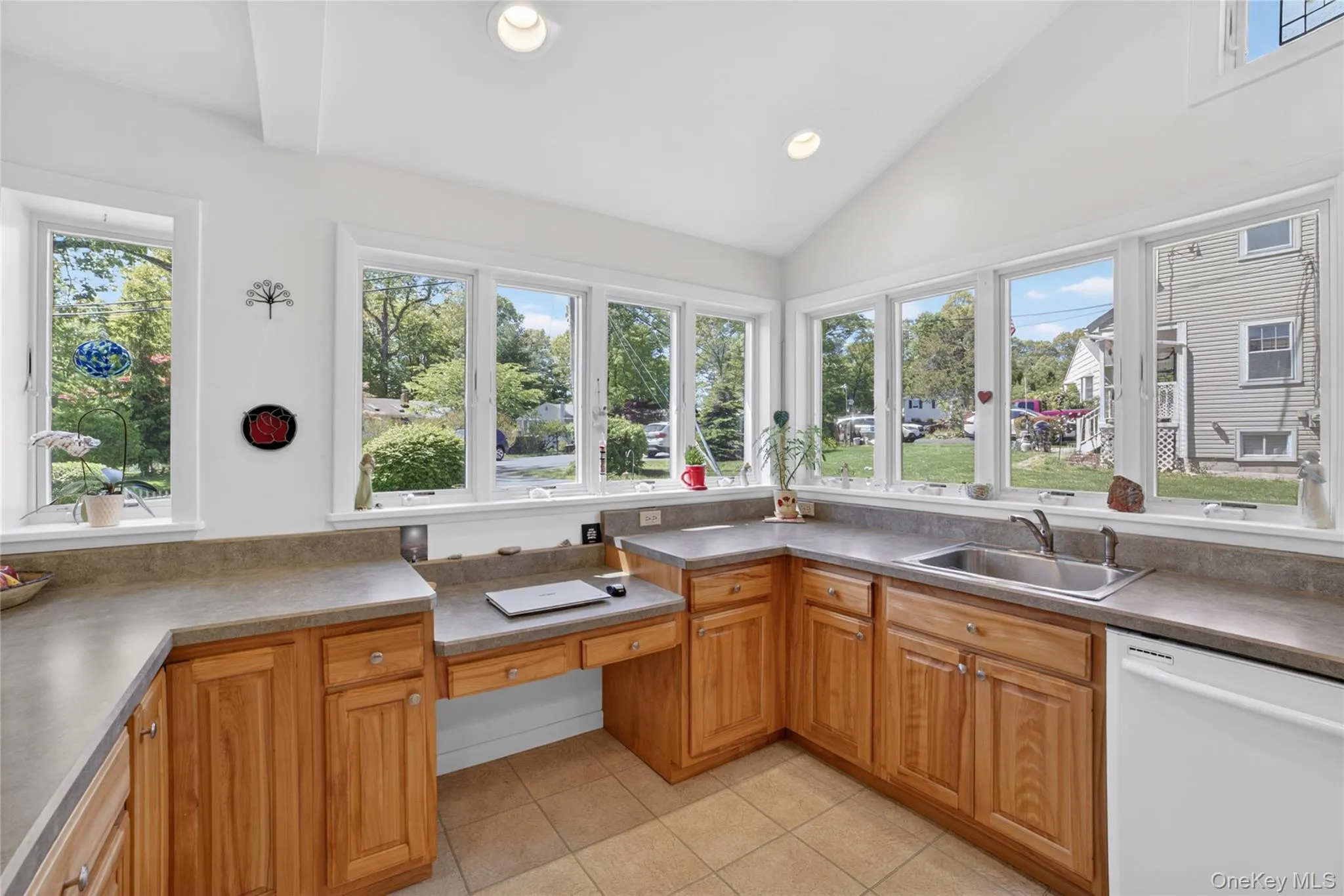 A built in desk, so much counter space and windows all around. A built in desk, so much counter space and windows all around.