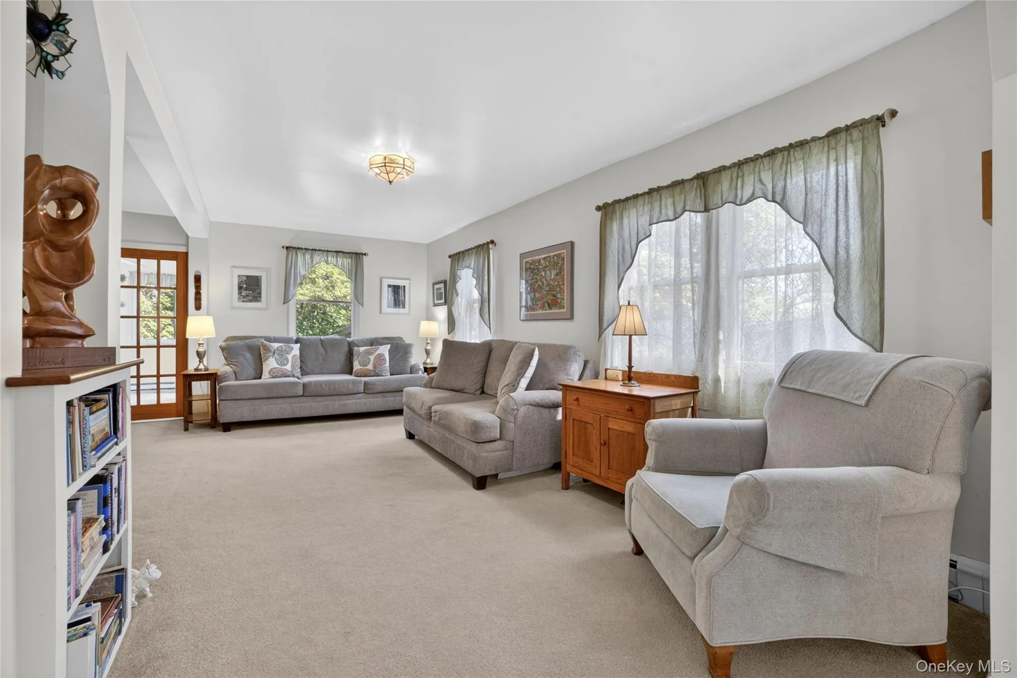 This living room continues with the light and airy bright and light theme of the house,. This living room continues with the light and airy bright and light theme of the house,.