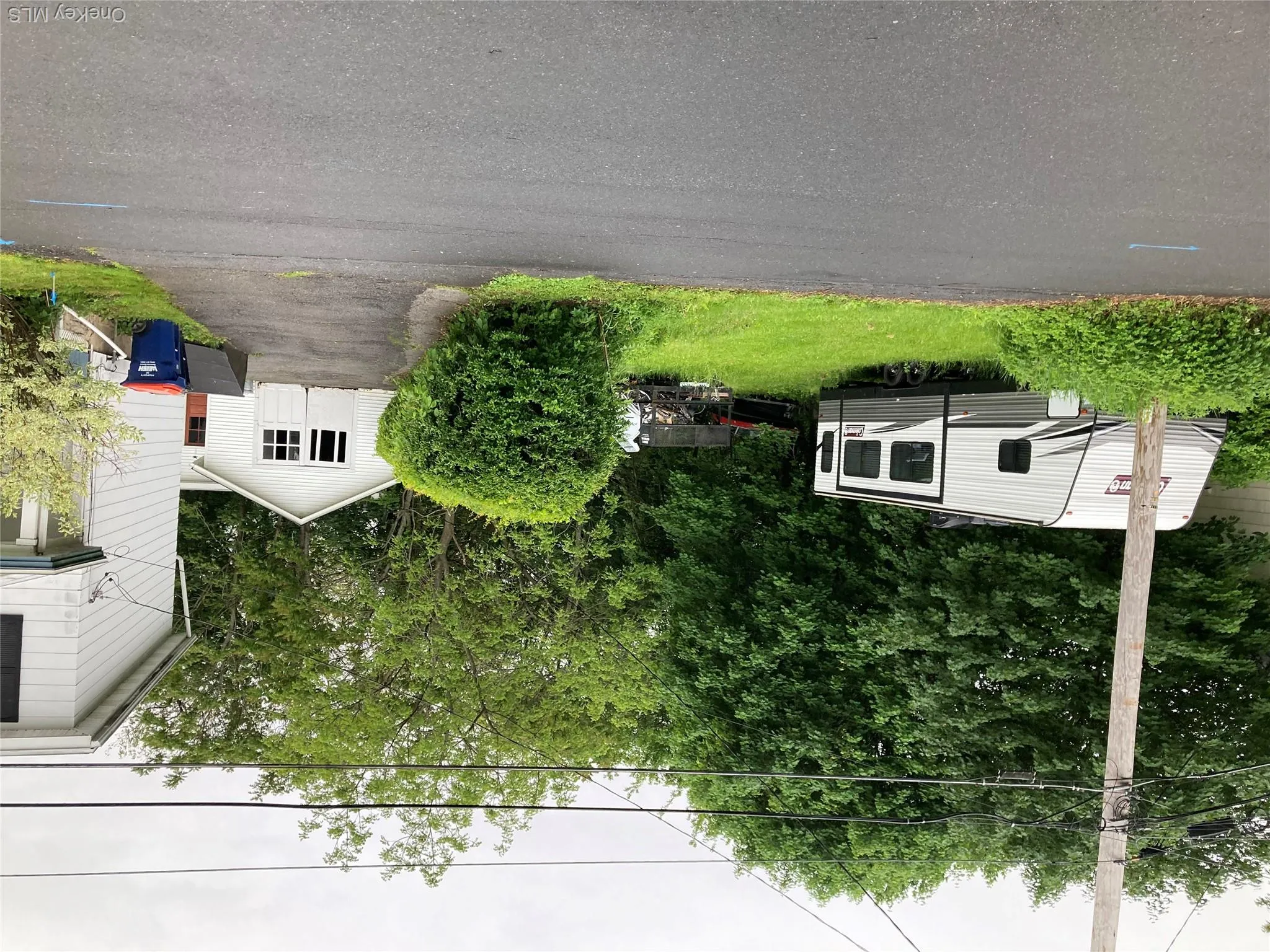View of front of home featuring an outbuilding, a garage, and driveway View of front of home featuring an outbuilding, a garage, and driveway
