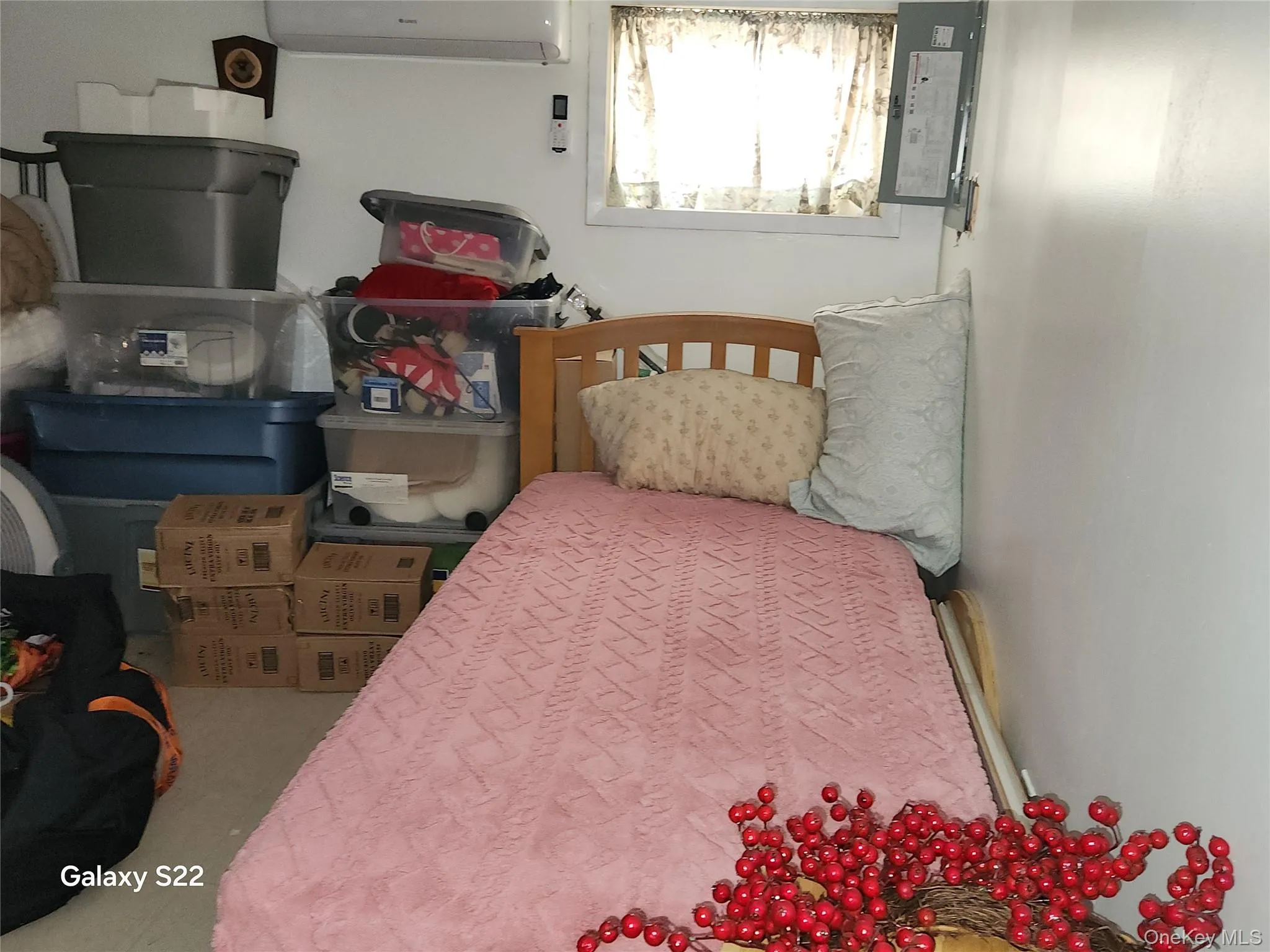 Bedroom featuring a wall mounted air conditioner Bedroom featuring a wall mounted air conditioner