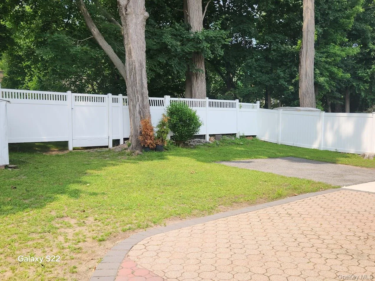 Fenced backyard with a patio Fenced backyard with a patio