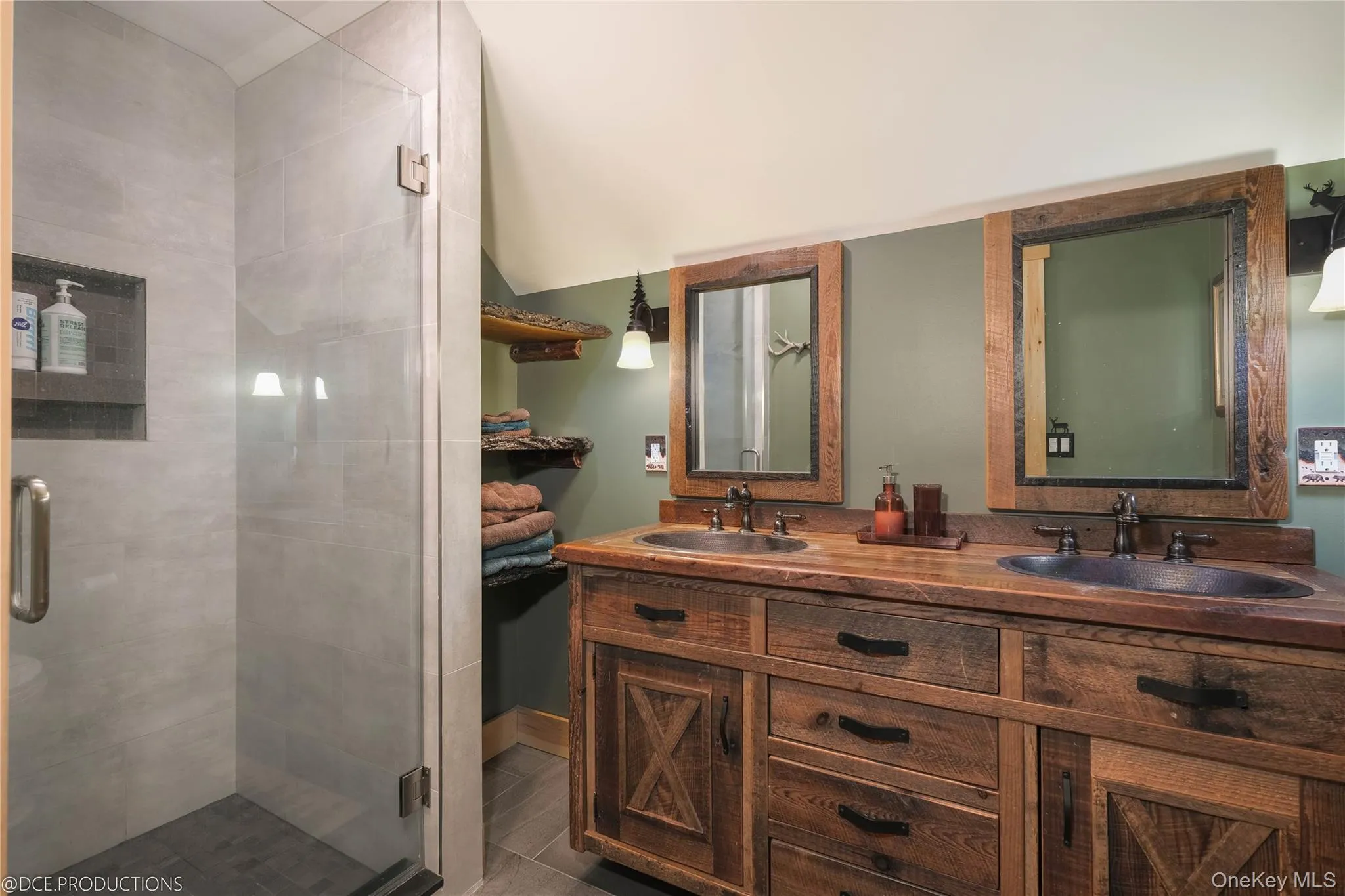 Bathroom with a tile and glass shower and double vanity Bathroom with a tile and glass shower and double vanity