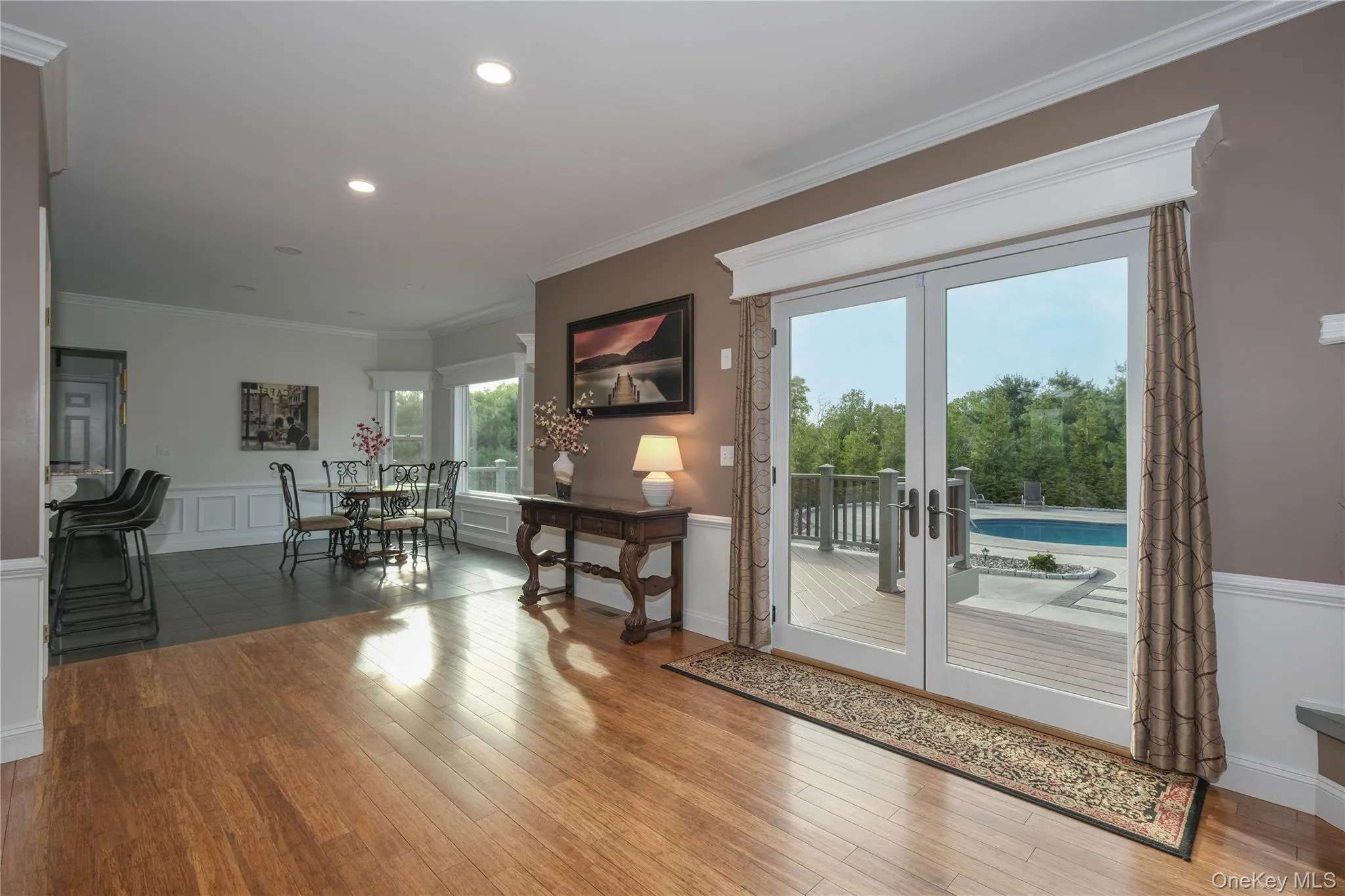 Living room flows seamlessly to an informal dining area and open kitchen - all overlooking the manicured grounds. Living room flows seamlessly to an informal dining area and open kitchen - all overlooking the manicured grounds.