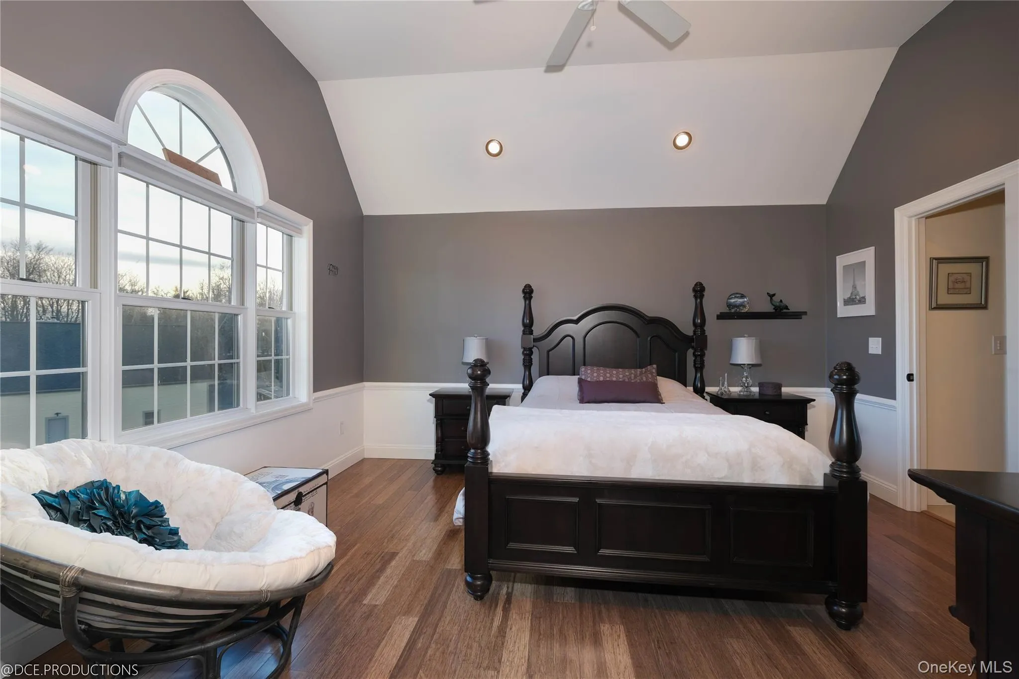 Bedroom featuring hardwood floors, high ceilings, large windows recessed lighting and ensuite bath access. Bedroom featuring hardwood floors, high ceilings, large windows recessed lighting and ensuite bath access.