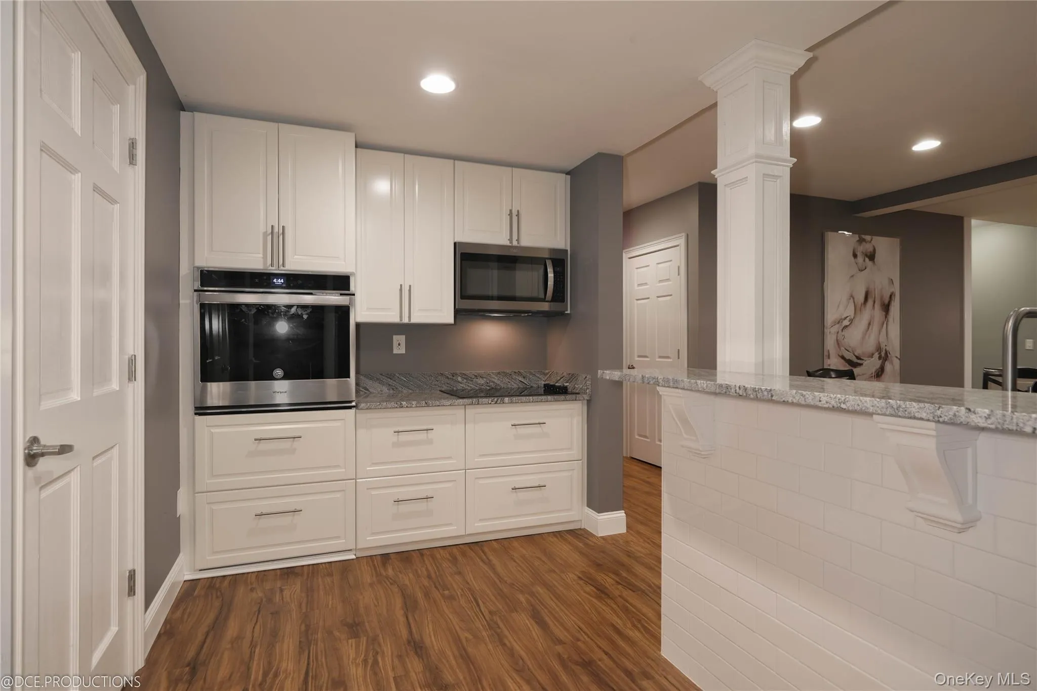 Kitchen featuring white cabinetry, stainless appliances, recessed lighting and dining area. Kitchen featuring white cabinetry, stainless appliances, recessed lighting and dining area.