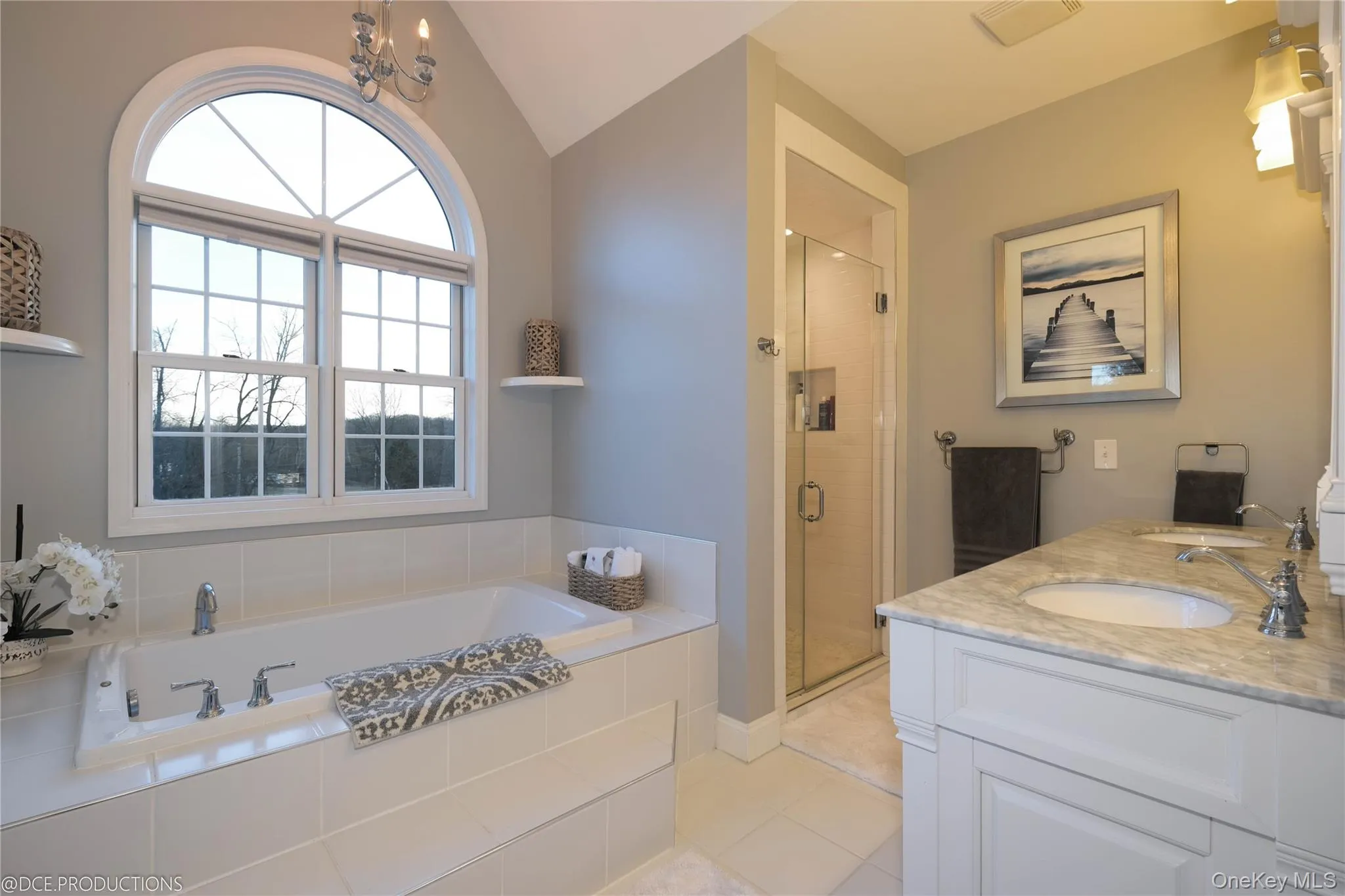 Primary Bath with garden tub, separate shower, double vanity, tile flooring and palladian window. Primary Bath with garden tub, separate shower, double vanity, tile flooring and palladian window.