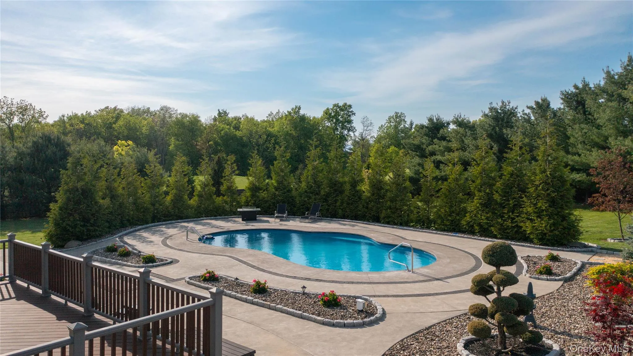 Extensive space to gather, entertain and lounge. Lighted, heated pool with fountain. Extensive space to gather, entertain and lounge. Lighted, heated pool with fountain.