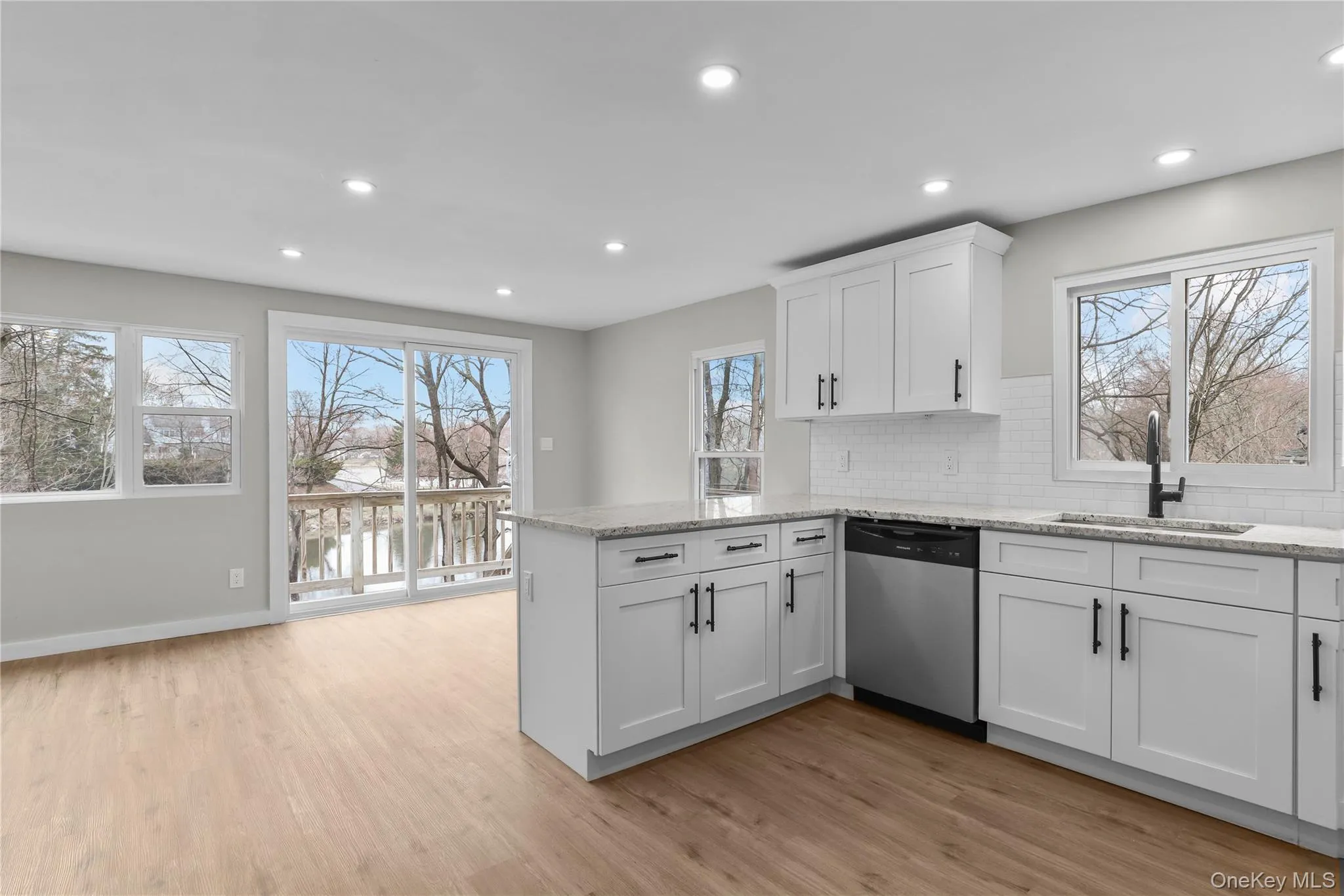 Kitchen and Dining Area with sliding glass doors to deck over looking Lake Carmel Kitchen and Dining Area with sliding glass doors to deck over looking Lake Carmel