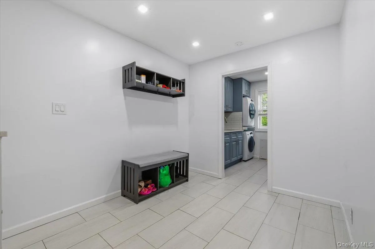 Light-toned tile flooring throughout an open space featuring recessed lighting Light-toned tile flooring throughout an open space featuring recessed lighting