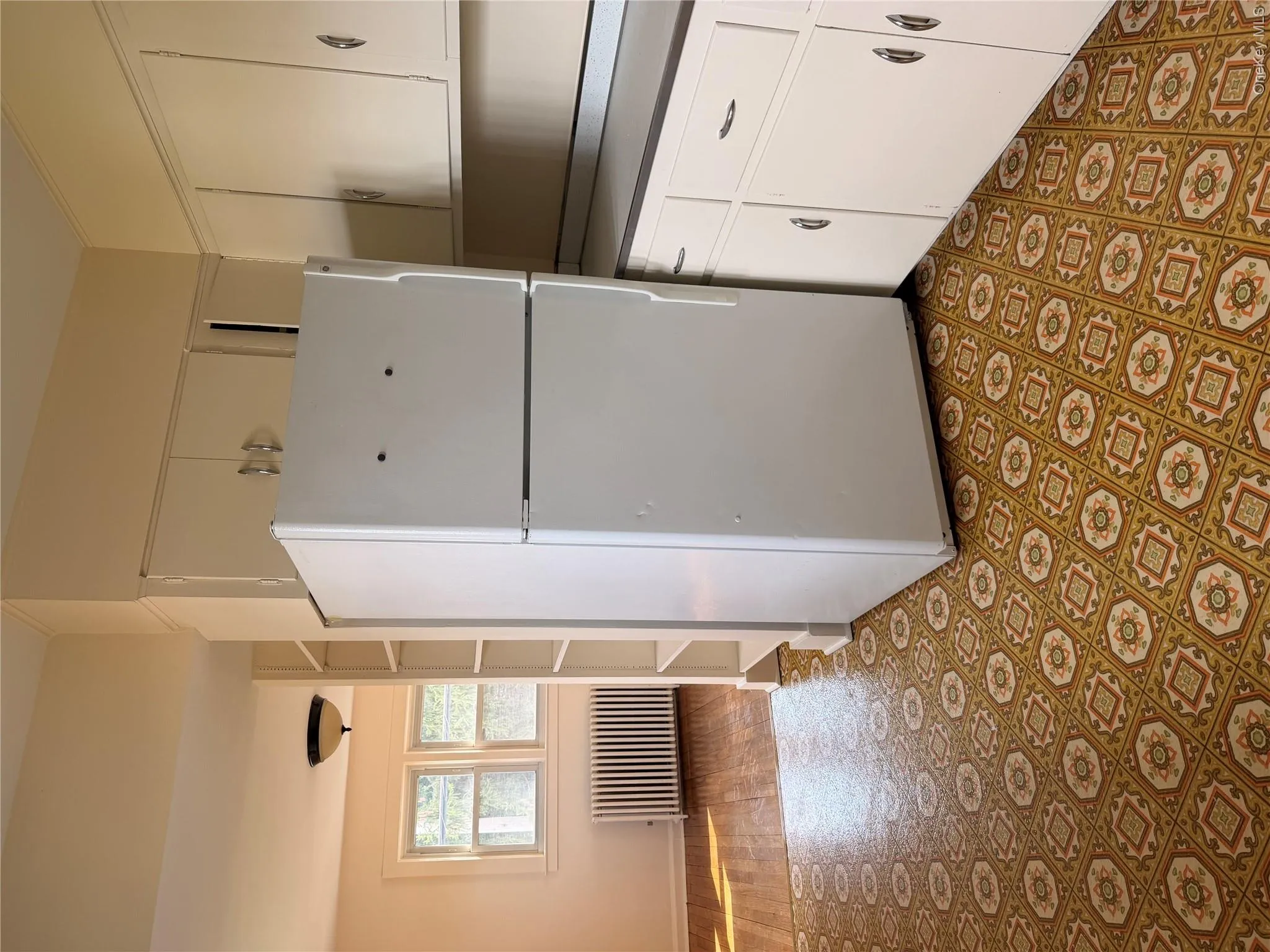 Part of the kitchen that leads to the open family room or den. The kitchen is large and bright. Part of the kitchen that leads to the open family room or den. The kitchen is large and bright.