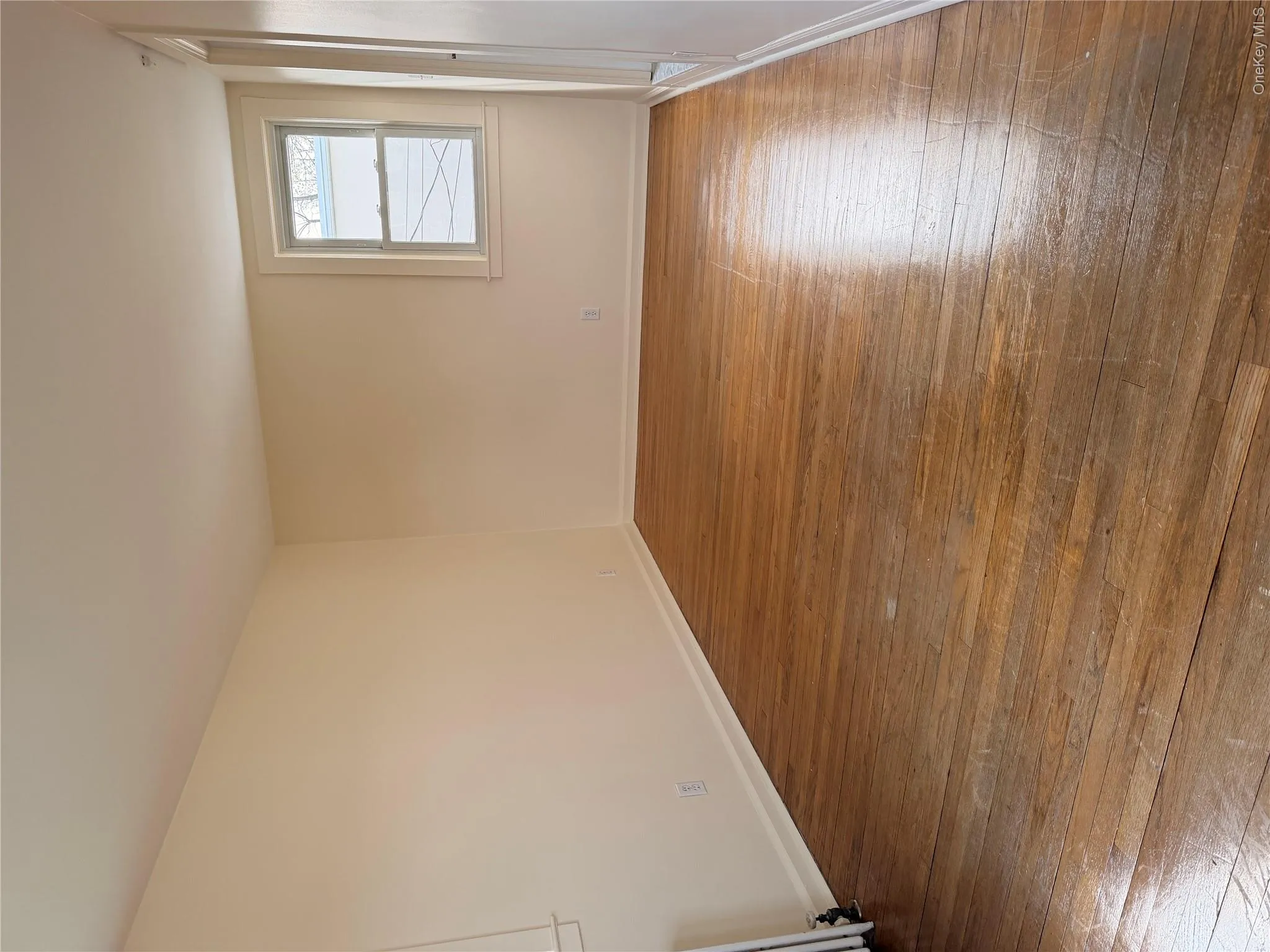 This is the den or family room, which also has a door leading to the bathroom and the stackable washer and dryer that come with the unit. This is the den or family room, which also has a door leading to the bathroom and the stackable washer and dryer that come with the unit.