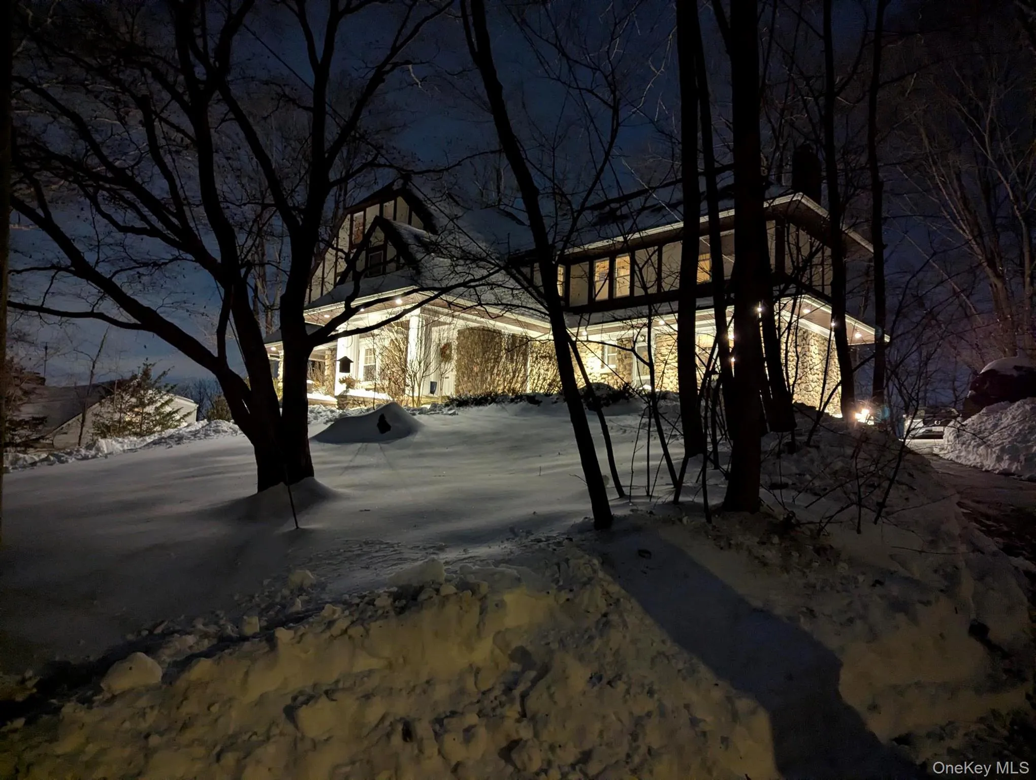 View of the home after a winter storm. View of the home after a winter storm.