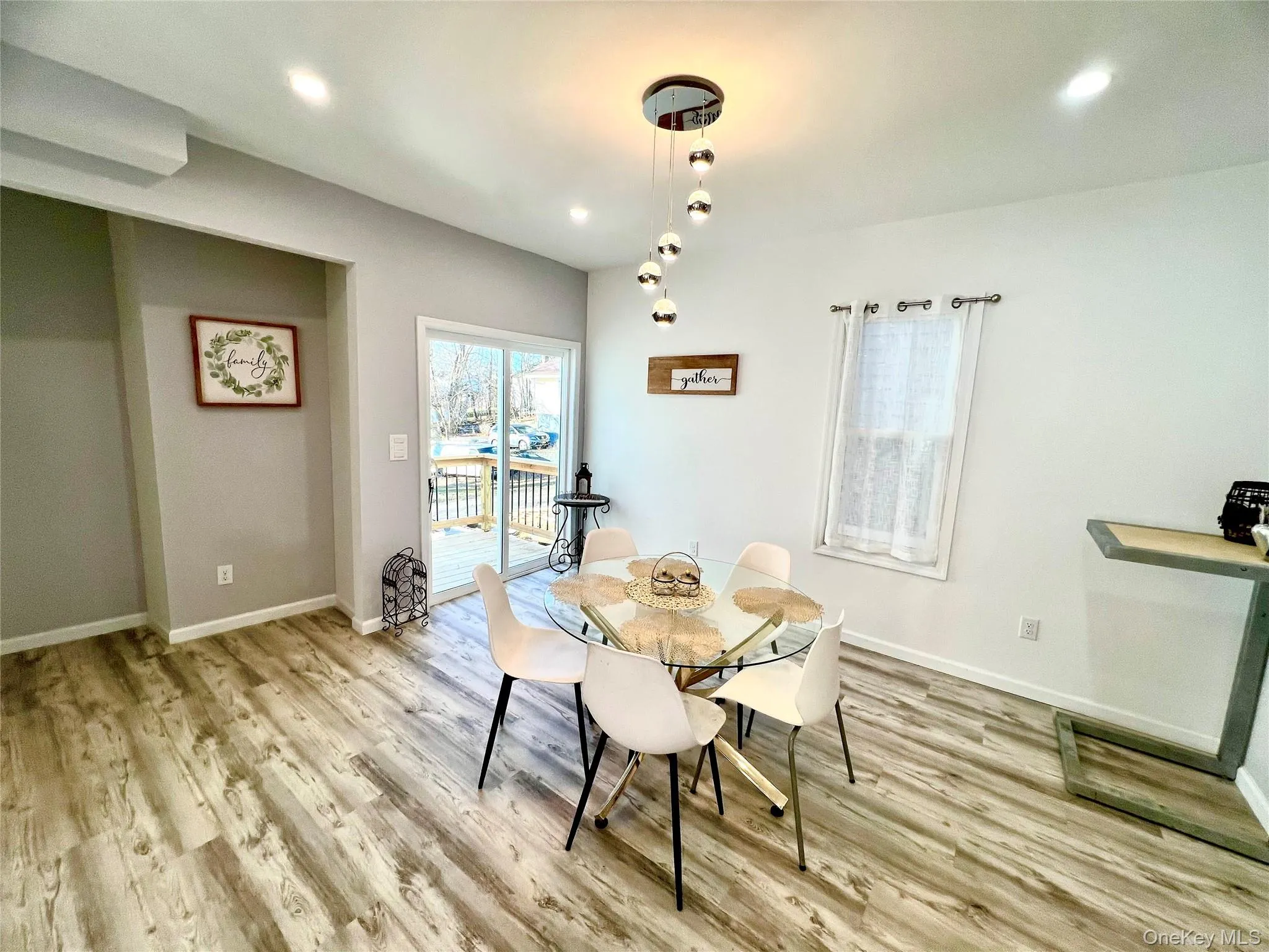 Dining area featuring light wood-style floors and recessed lighting Dining area featuring light wood-style floors and recessed lighting