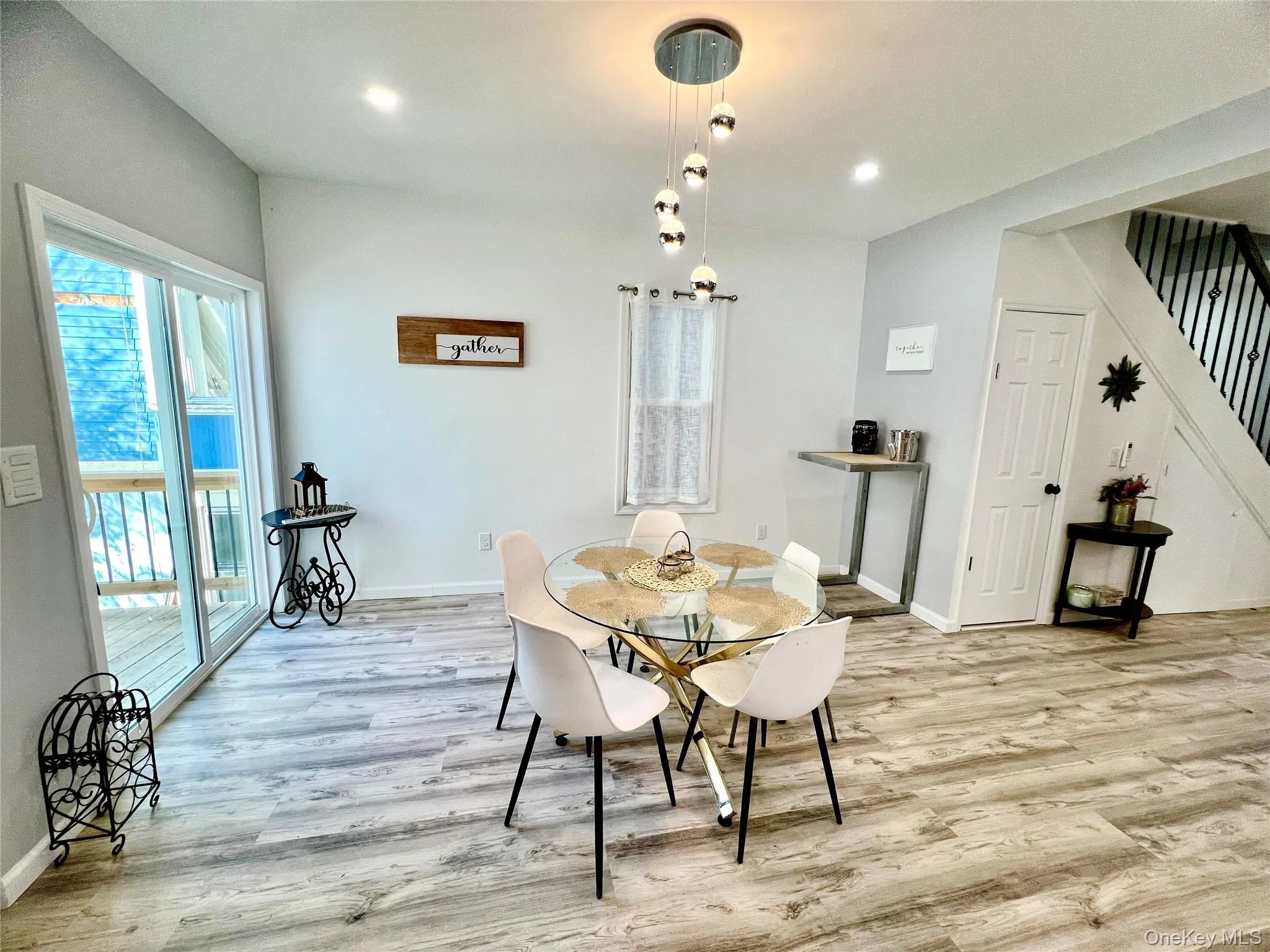 Dining area with plenty of natural light, stairway, light wood-type flooring, and recessed lighting Dining area with plenty of natural light, stairway, light wood-type flooring, and recessed lighting