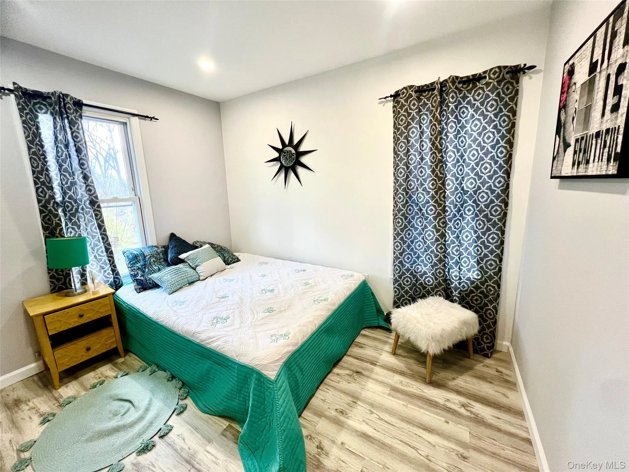 Bedroom featuring wood finished floors Bedroom featuring wood finished floors