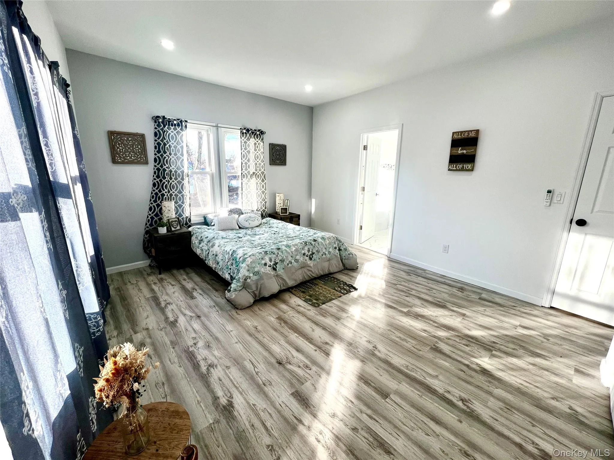 Bedroom featuring wood finished floors and recessed lighting Bedroom featuring wood finished floors and recessed lighting
