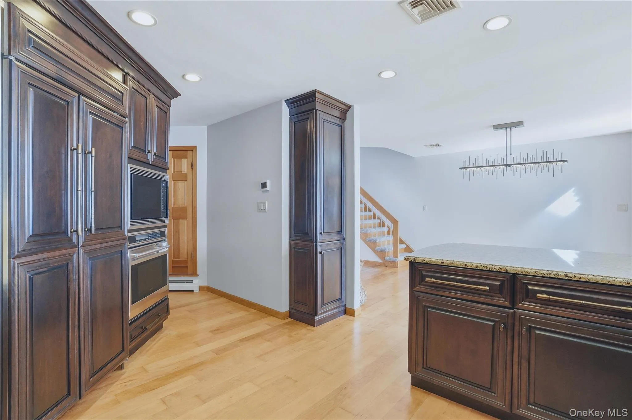 Built in custom cabinets, fridge and microwave. Built in custom cabinets, fridge and microwave.