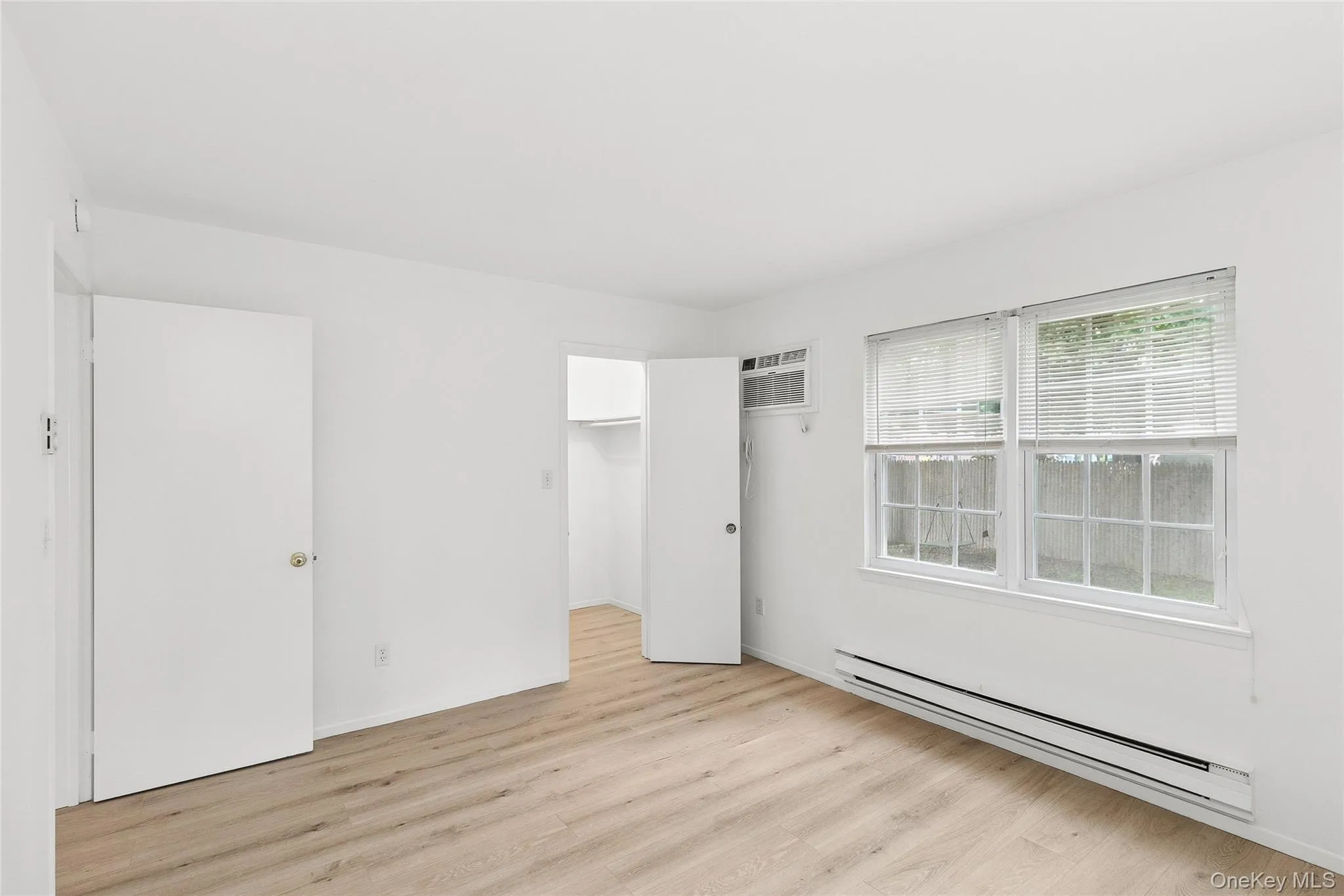 Bedroom and walk-in closet. Bedroom and walk-in closet.