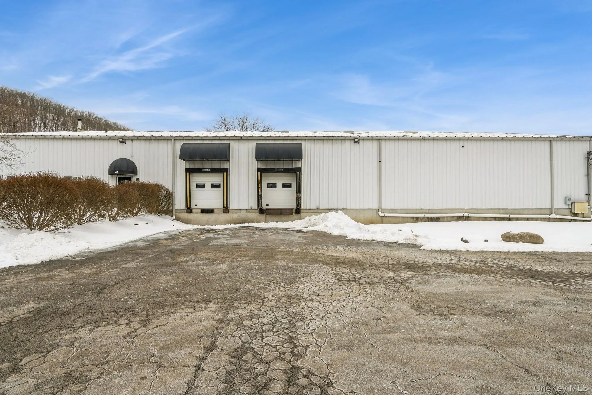 Front of Warehouse featuring two loading docks. Front of Warehouse featuring two loading docks.