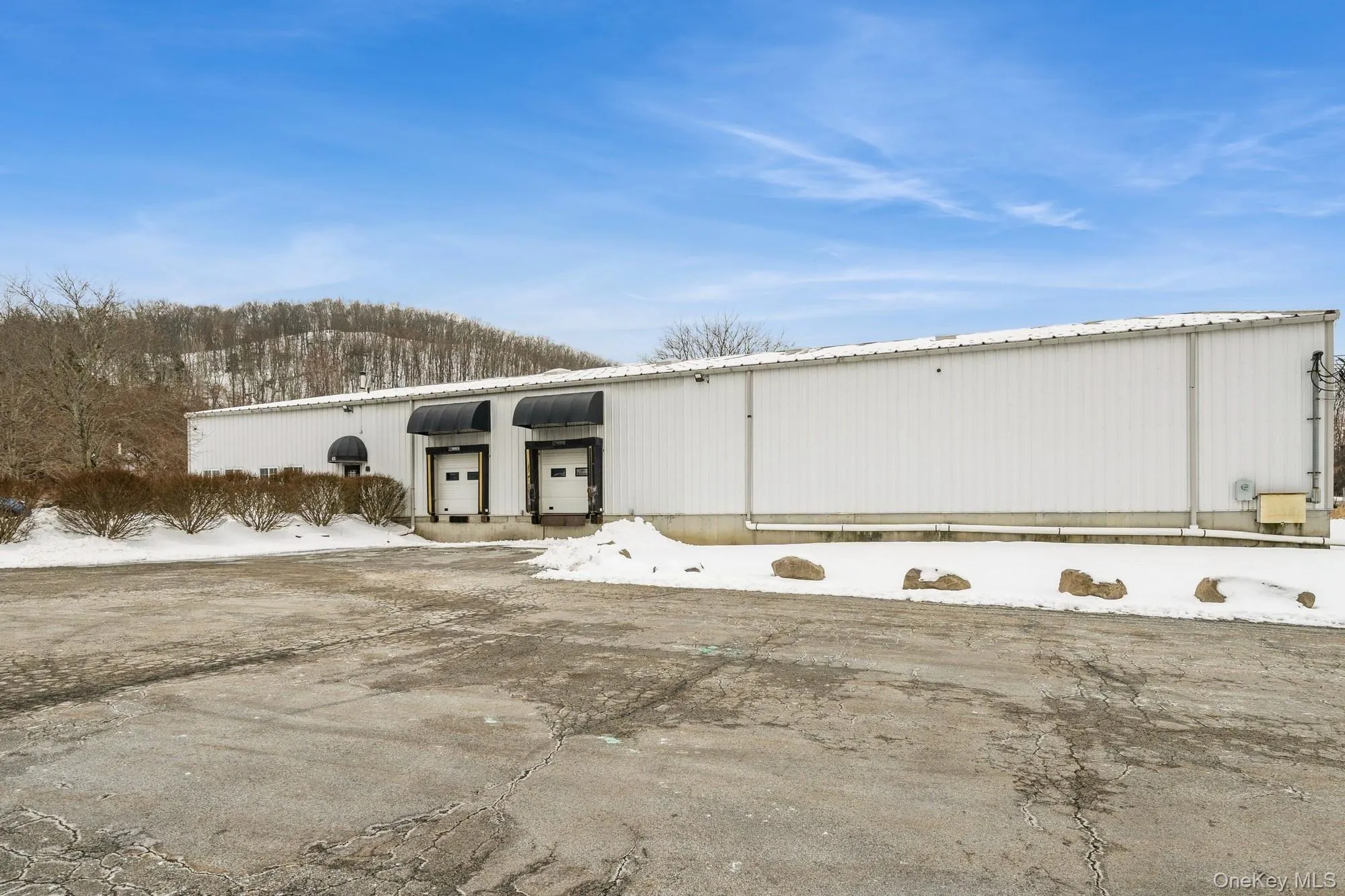 Front of Warehouse featuring two loading docks. Front of Warehouse featuring two loading docks.