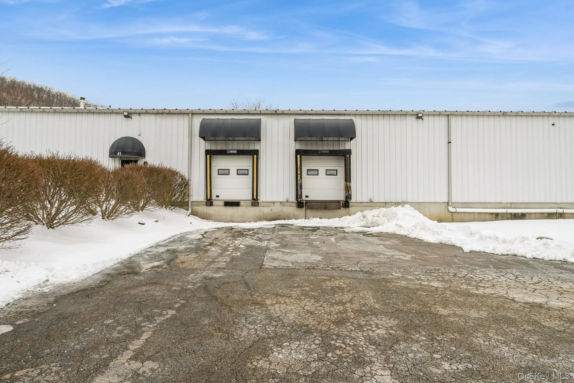 Front of Warehouse featuring two loading docks. Front of Warehouse featuring two loading docks.
