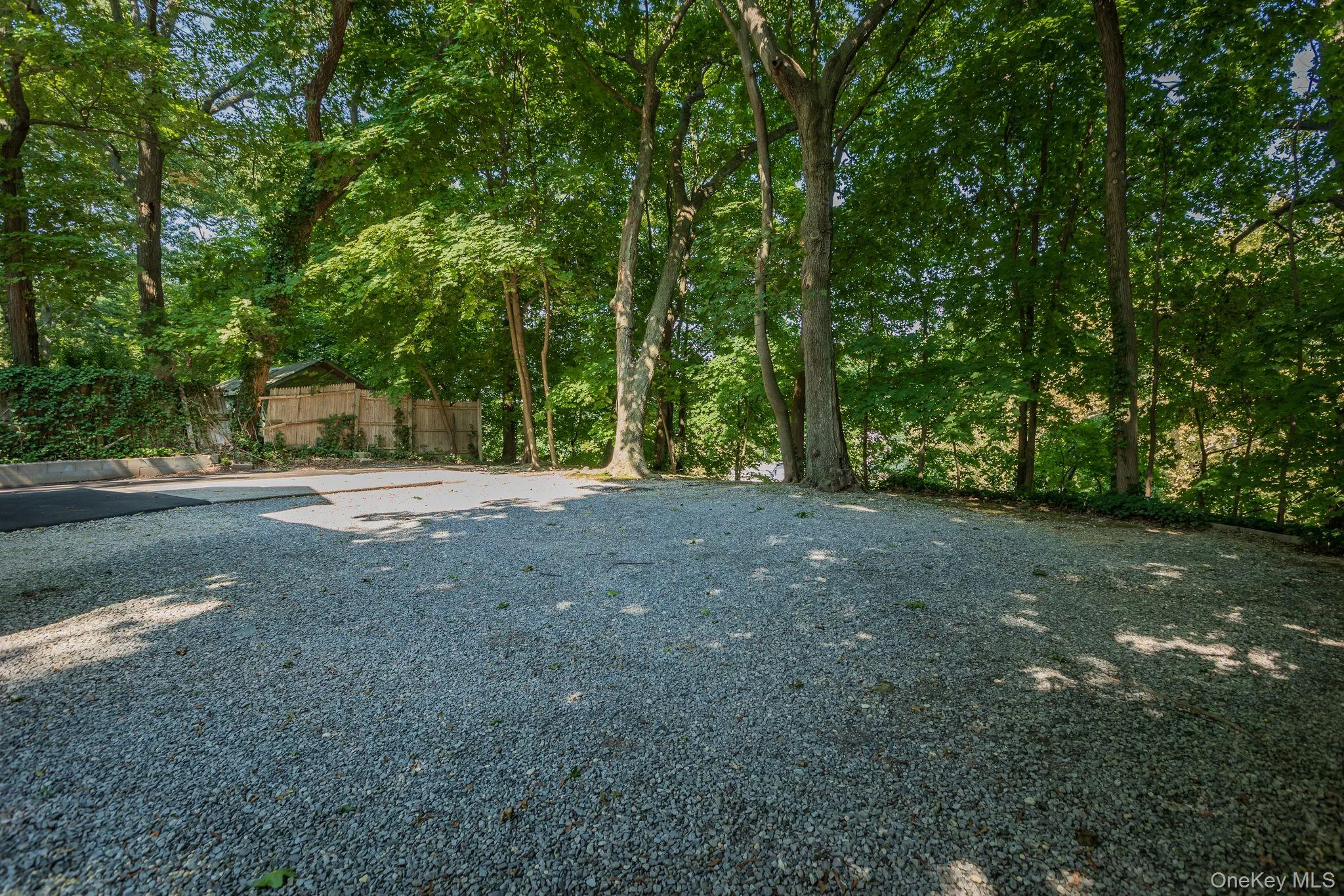Large parking area located at the rear of the home Large parking area located at the rear of the home