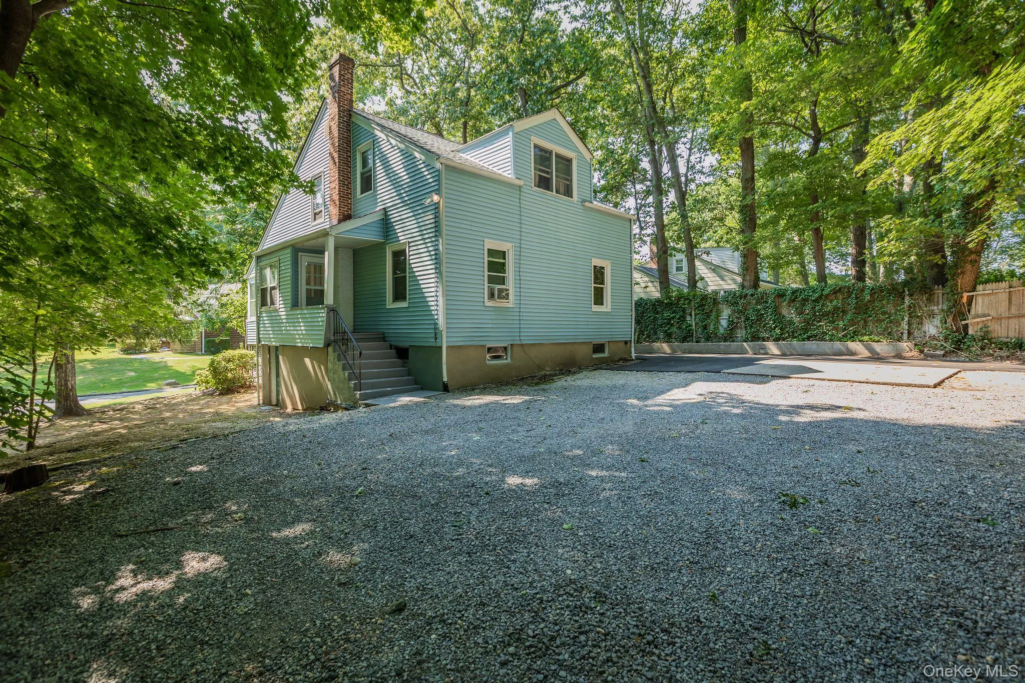 Back of the house with parking area. Back of the house with parking area.