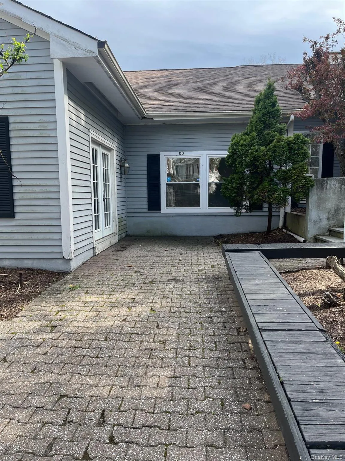 Paver patio with a raised garden bed Paver patio with a raised garden bed