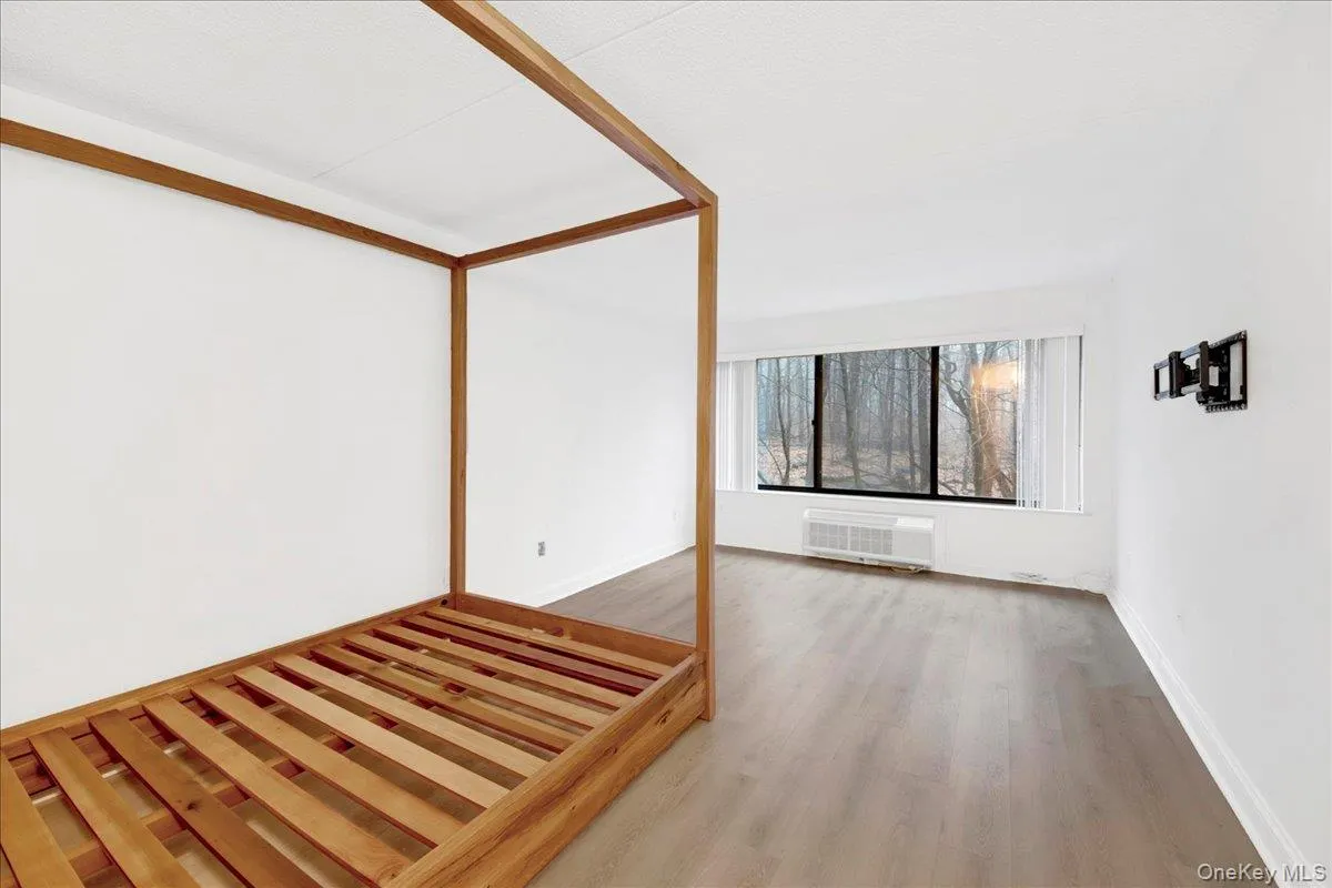 Spare room with light wood finished floors and HVAC unit Spare room with light wood finished floors and HVAC unit