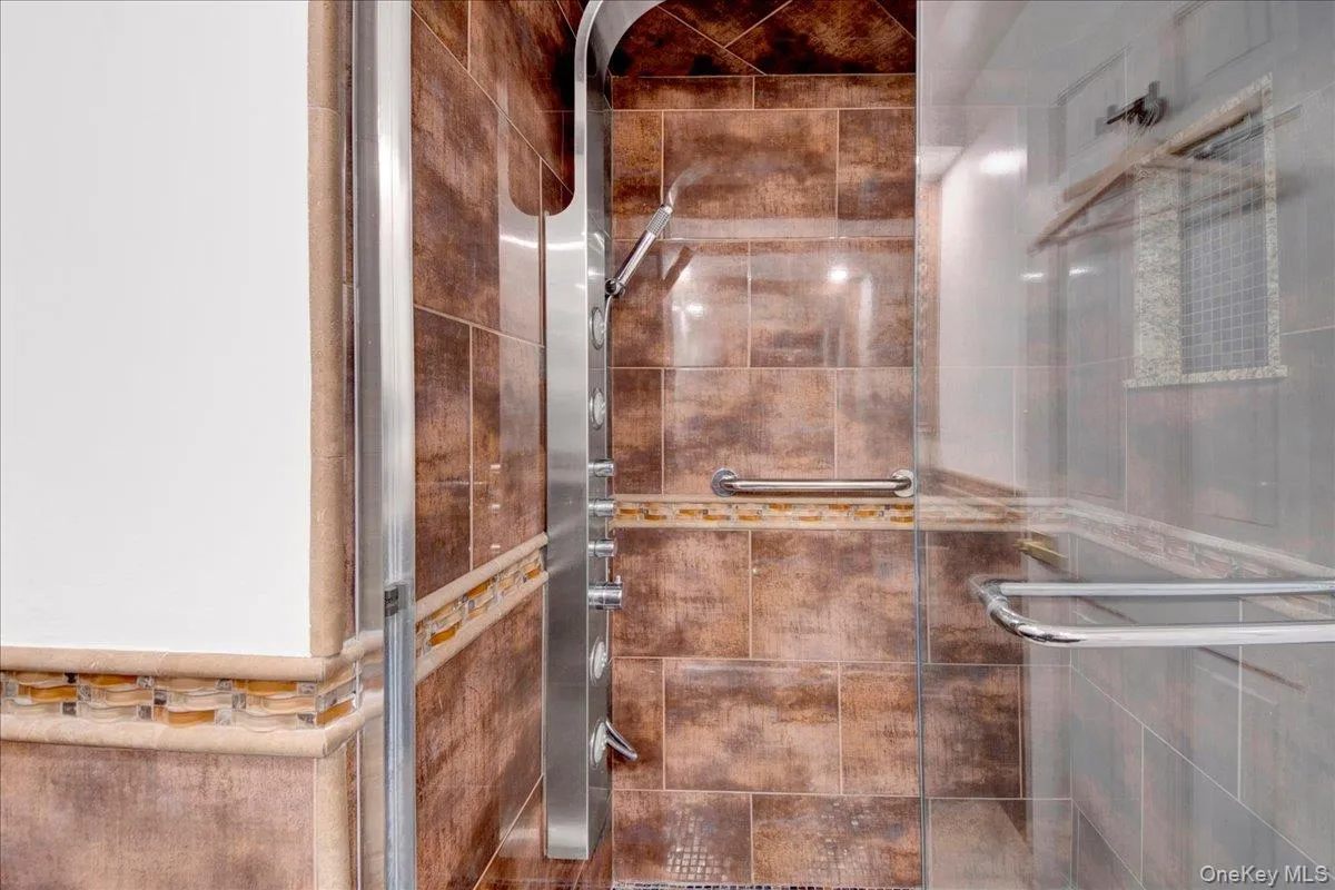 Full bathroom with a shower stall Full bathroom with a shower stall