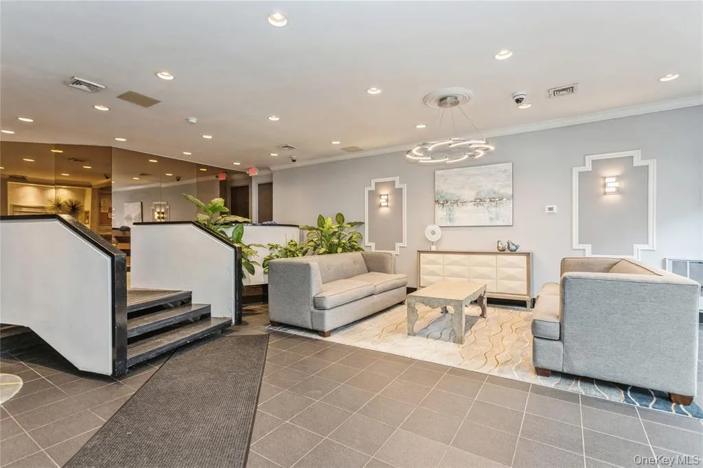 Common area featuring recessed lighting and ornamental molding Common area featuring recessed lighting and ornamental molding