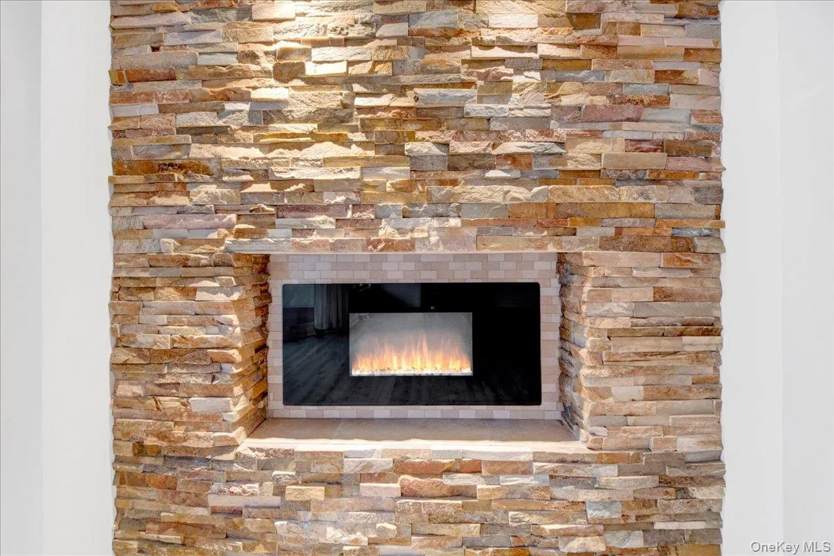 Detailed view of a lit gas fireplace Detailed view of a lit gas fireplace